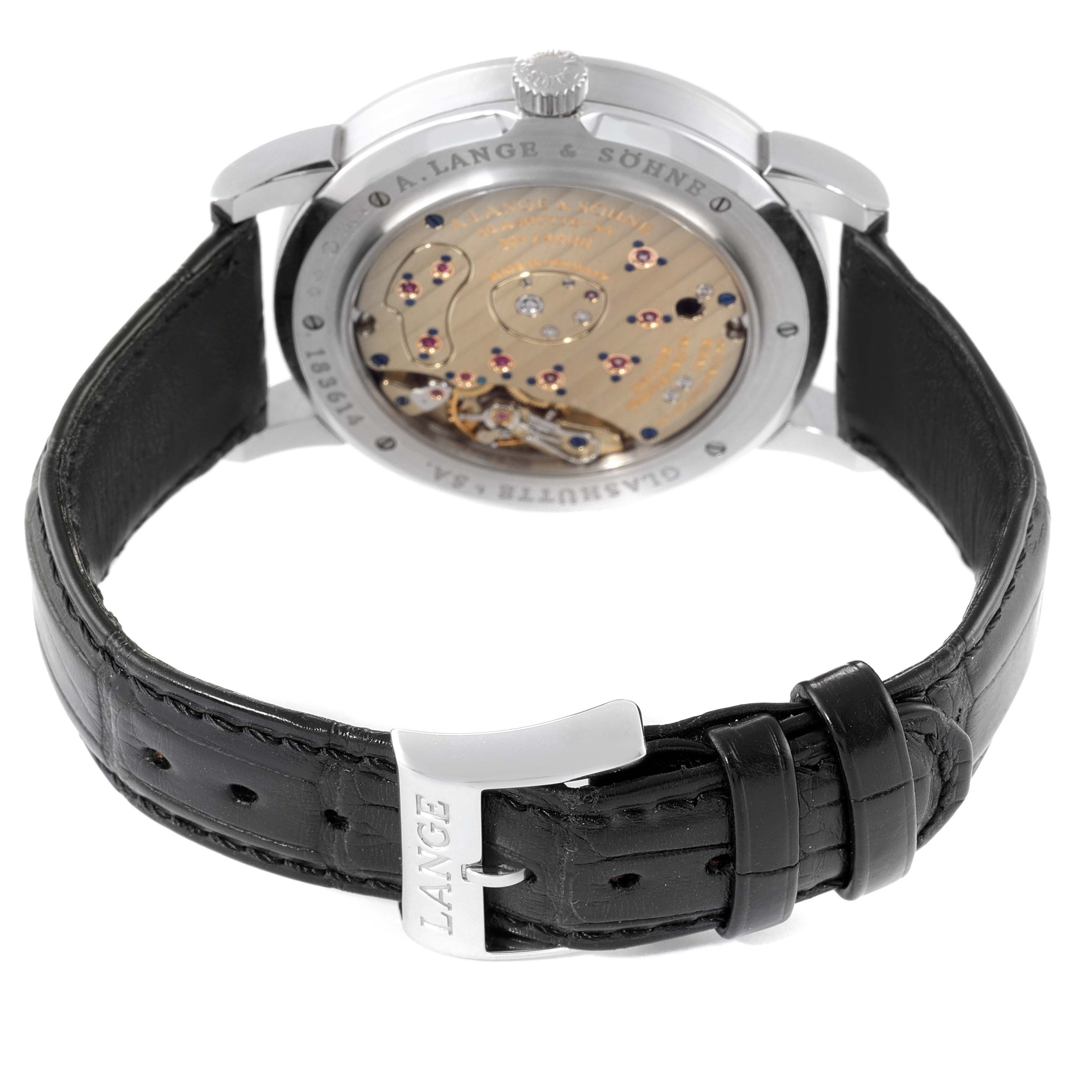 The image shows the back view of the A. Lange & Sohne Grand Lange One Platinum Men's Watch 115.026, displaying its intricate movement and black leather strap.
