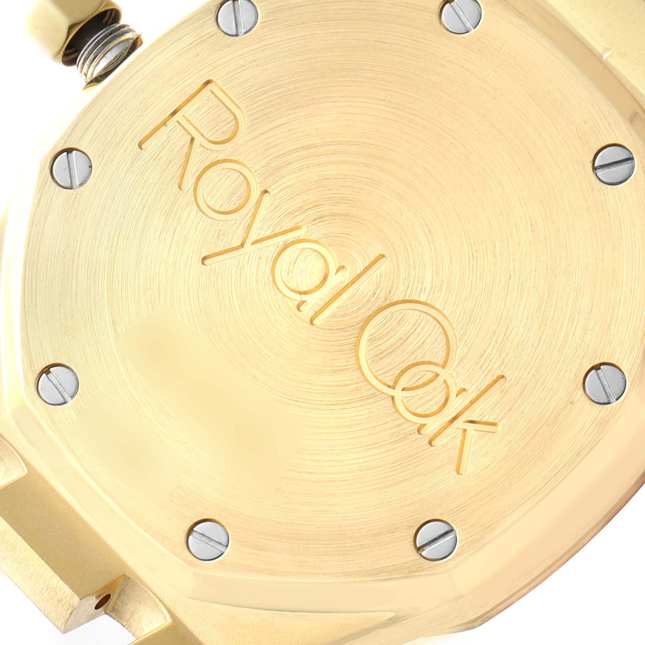 This image shows the case back of an Audemars Piguet Royal Oak 14790BA Men's Yellow Gold Champagne Dial 14790BA Men's Yellow Gold Champagne Dial watch from a close-up angle.