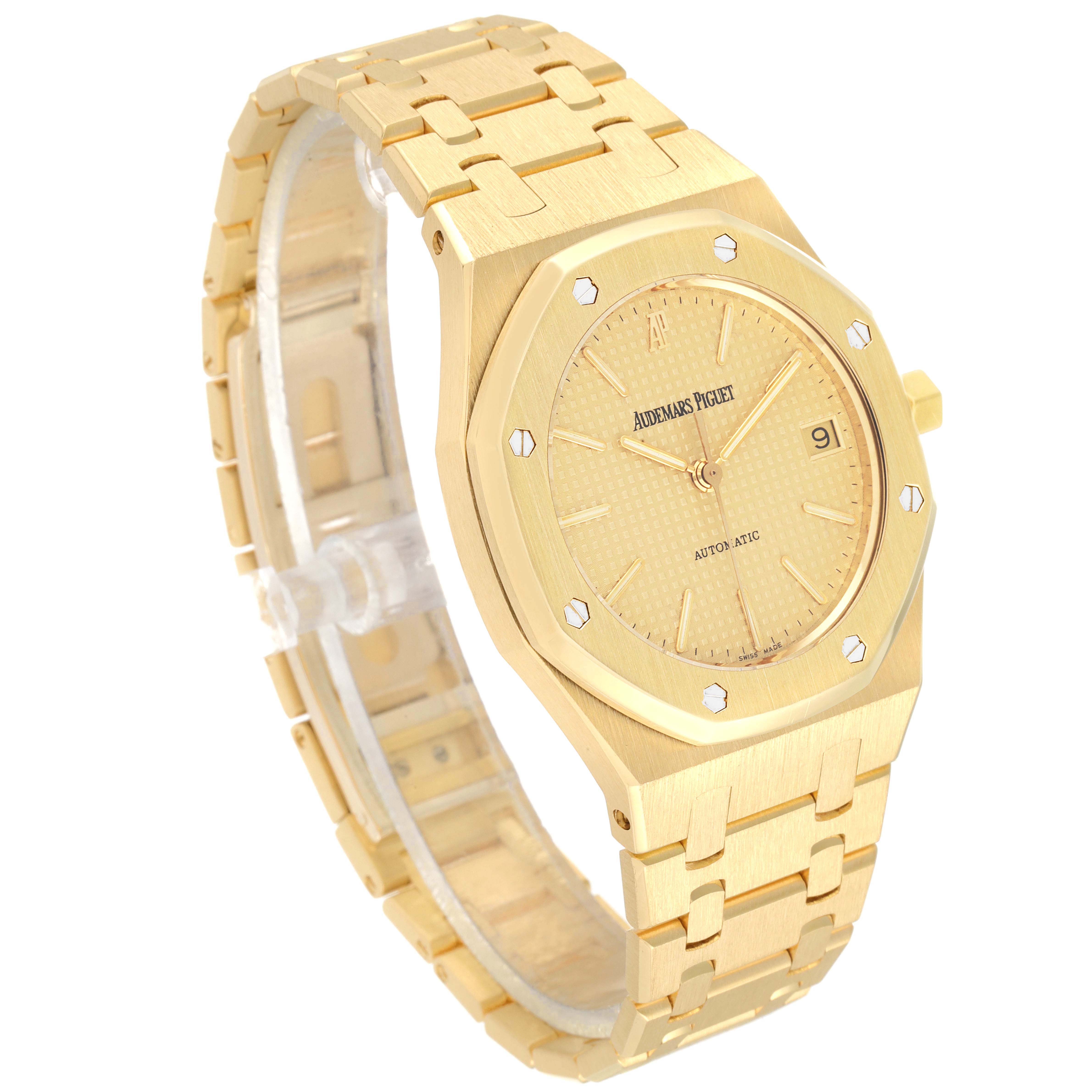 The Audemars Piguet Royal Oak 14790BA Men's Yellow Gold Champagne Dial 14790BA Men's Yellow Gold Champagne Dial watch is shown at a three-quarter angle, highlighting the bracelet, bezel, and dial.