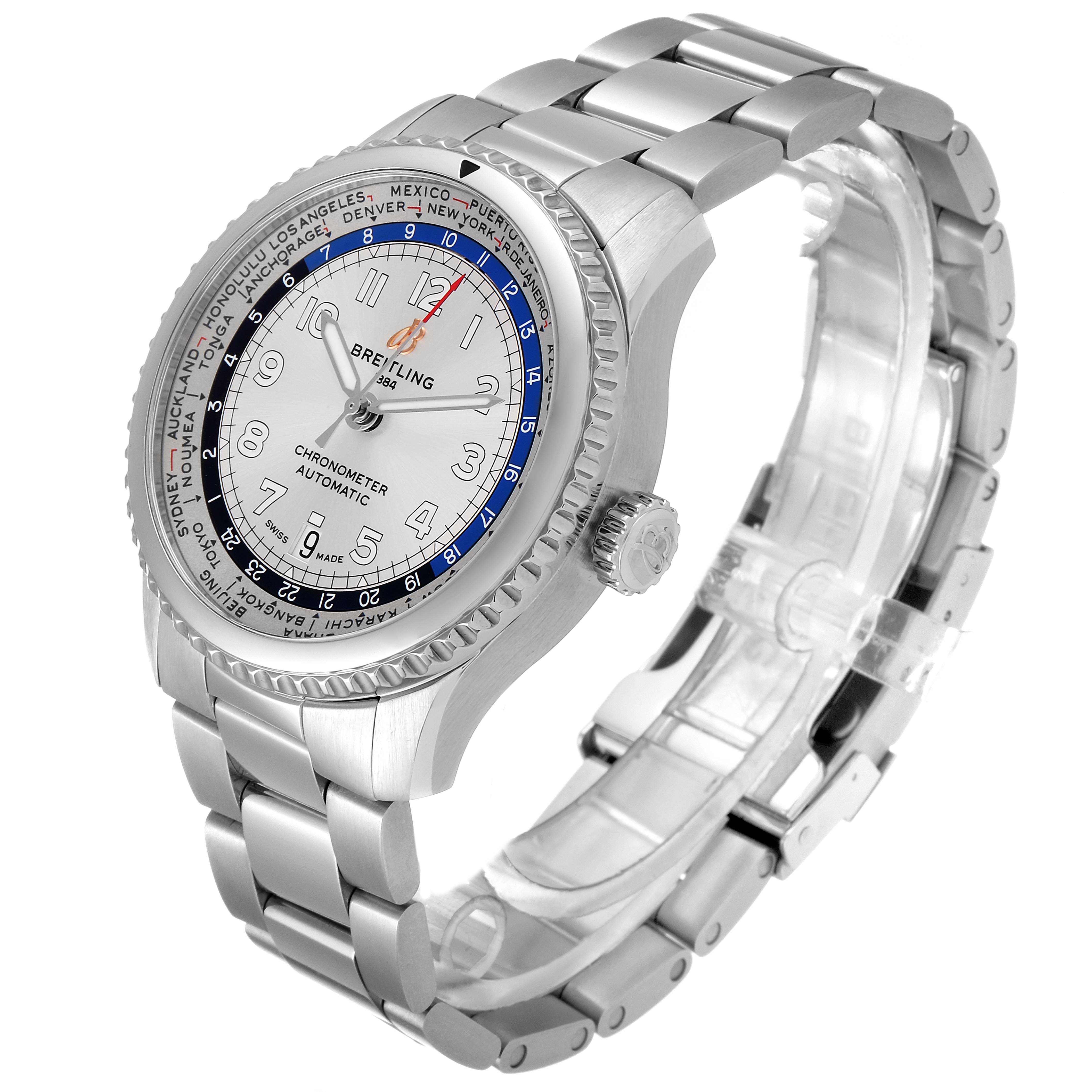 The Breitling Navitimer watch is shown at a slight angle, highlighting its face, bezel, and metal bracelet.