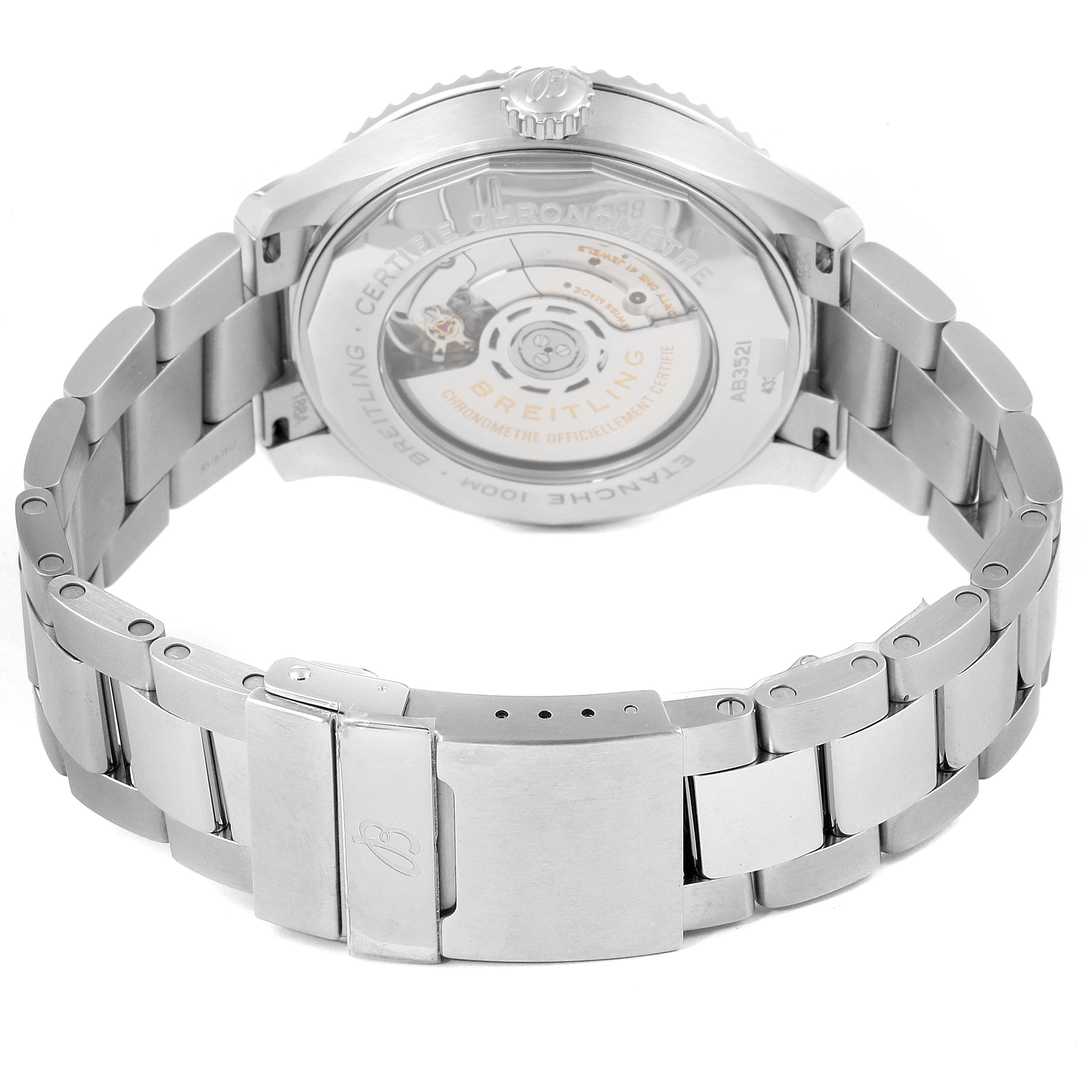 This image shows the back angle of the Breitling Navitimer watch, focusing on its open case back and stainless steel bracelet.