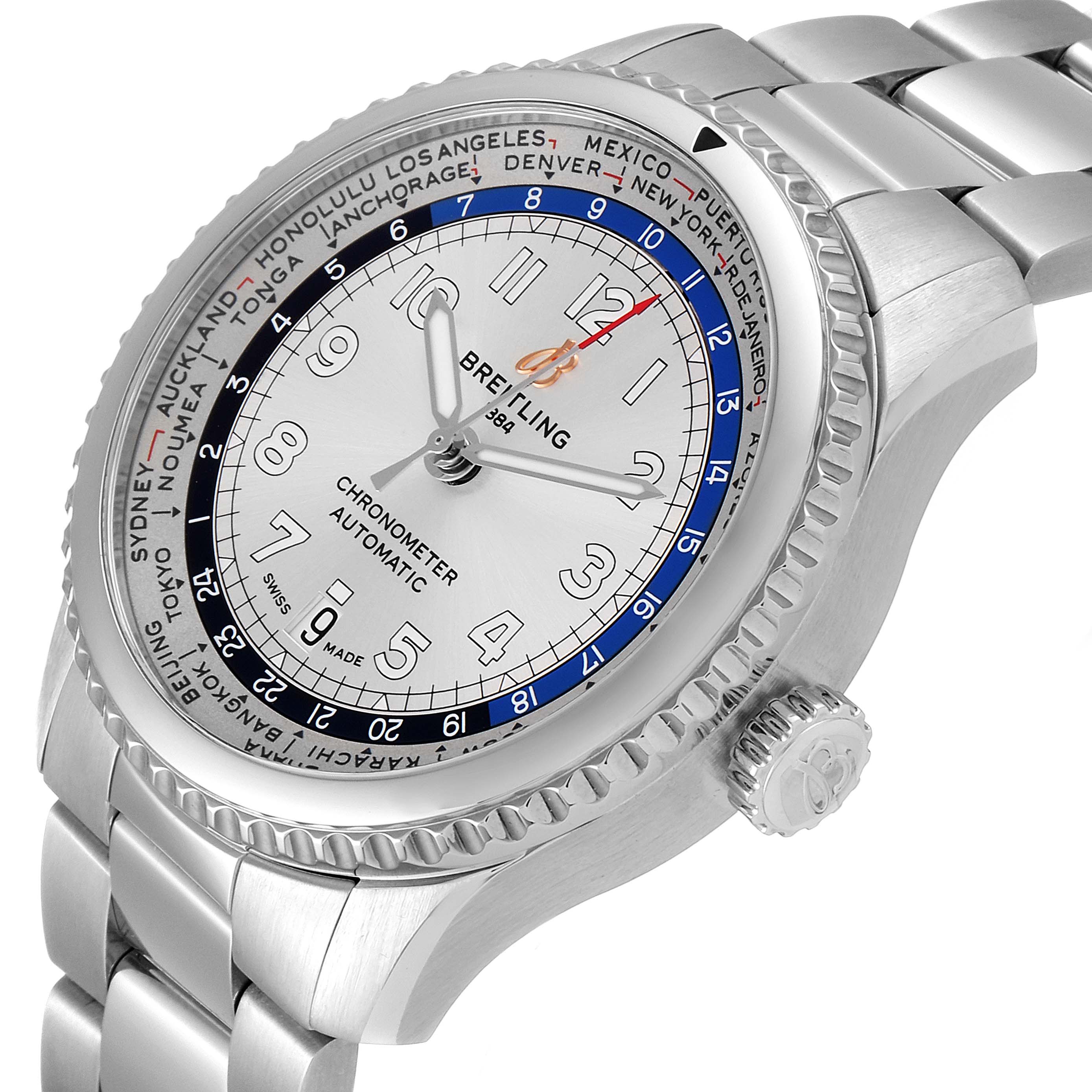 The Breitling Navitimer watch is shown at an angle, highlighting the face, bezel, crown, and metal bracelet.