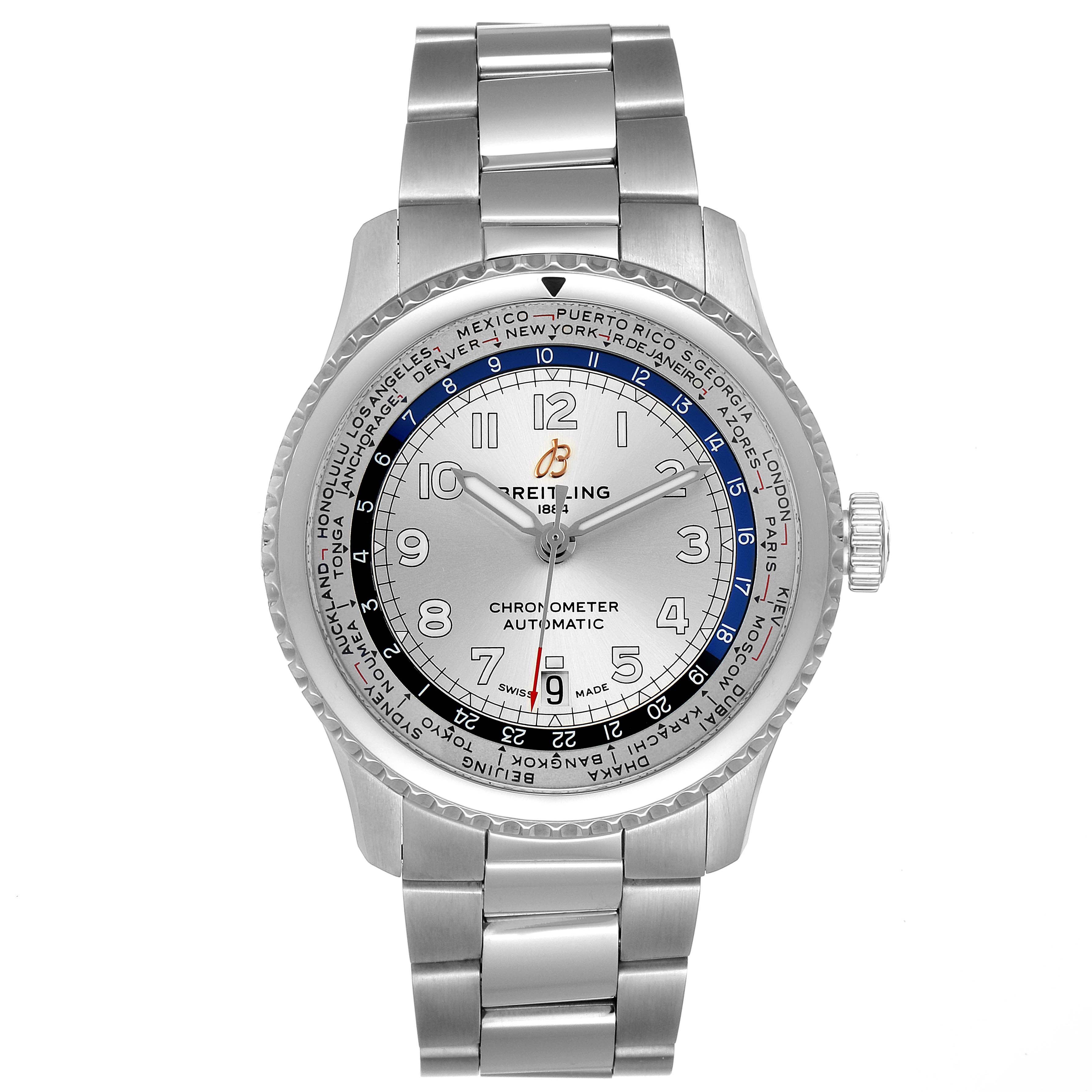 The Breitling Navitimer watch is shown from a front angle, displaying the dial, bezel, and bracelet.