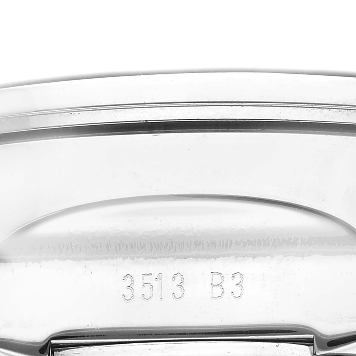 This is a close-up image of the case back of the Breitling Bentley AB0521 Men's Stainless Steel White Dial AB0521 Men's Stainless Steel White Dial model showing part of its serial number.