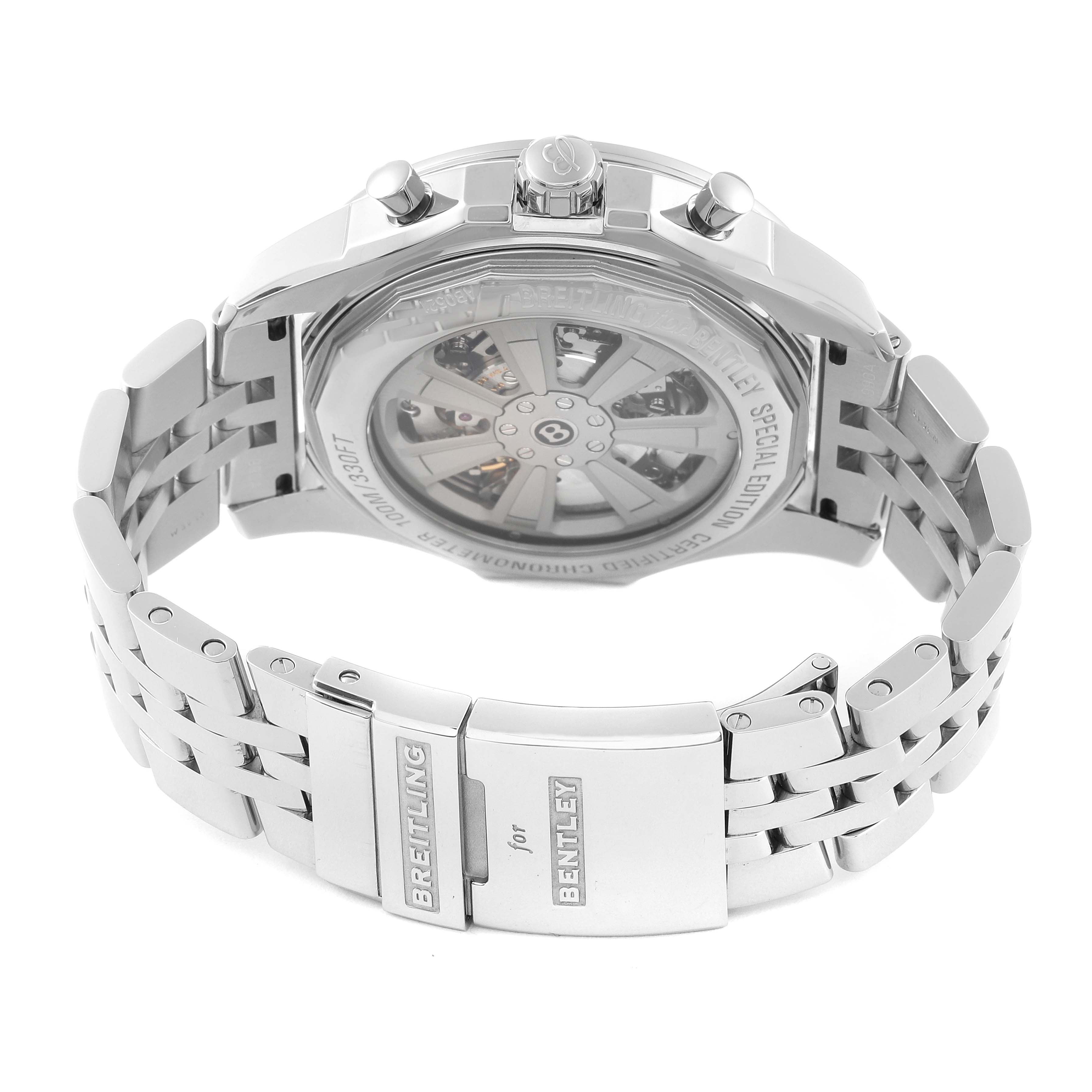 The image shows the back and clasp of a Bentley model by Breitling watch, highlighting the bracelet and transparent case back.