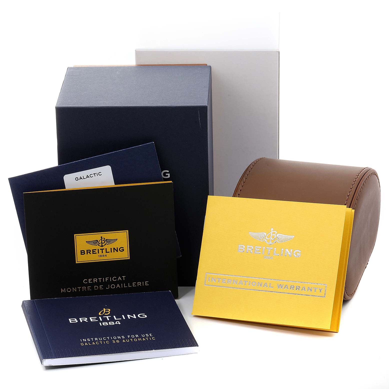 The image shows the packaging and accessories of a Breitling Galactic A37330 Men's Stainless Steel Mother of Pearl Dial A37330 Men's Stainless Steel Mother of Pearl Dial watch, including manuals, warranty cards, and a leather case.