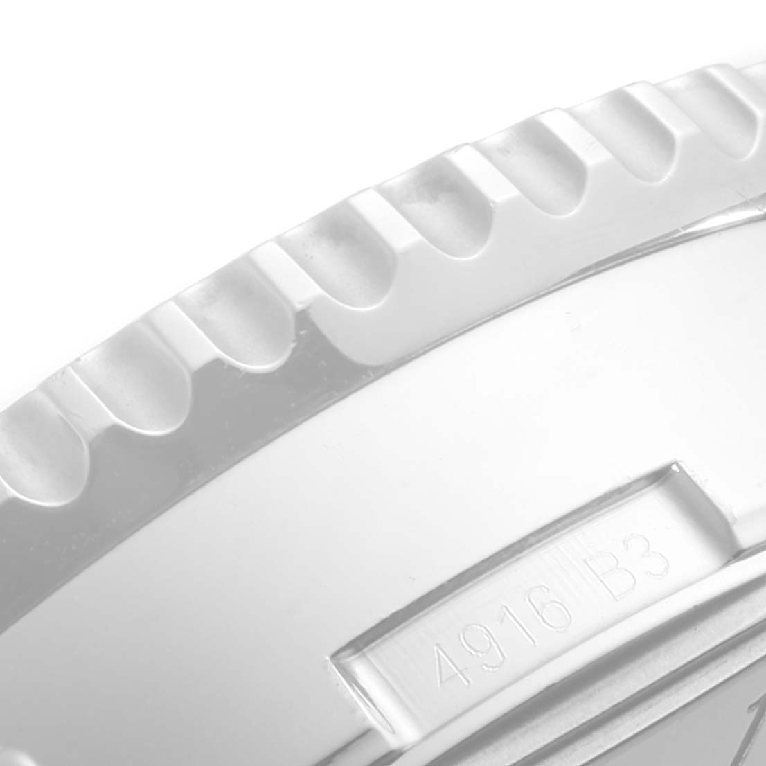 This image shows a close-up of the bezel and part of the case side of a Breitling Navitimer AB0127 Men's Stainless Steel Black Dial AB0127 Men's Stainless Steel Black Dial watch.