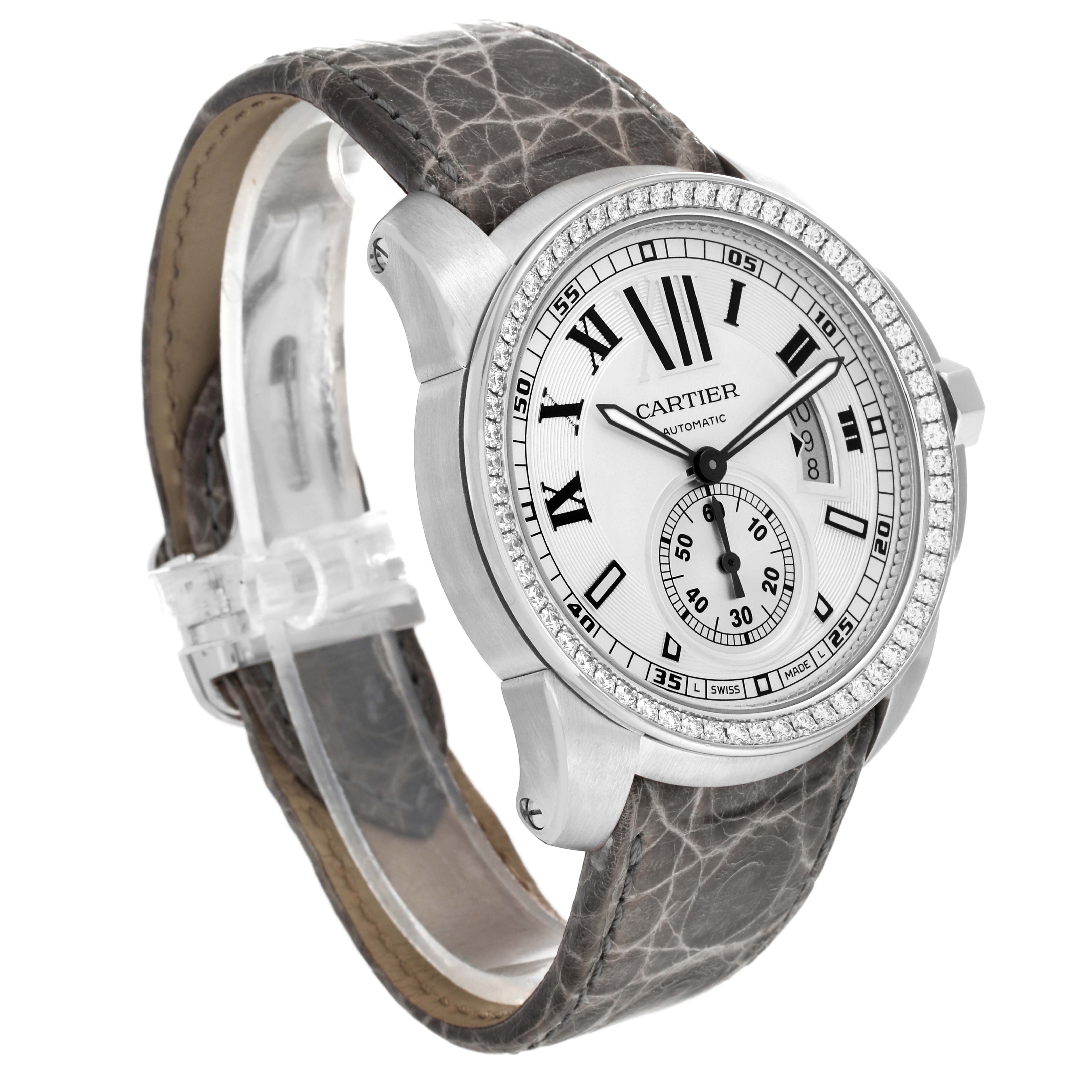 The image shows a Calibre de Cartier watch by Cartier from a three-quarter angle, highlighting the face, bezel, and leather strap.