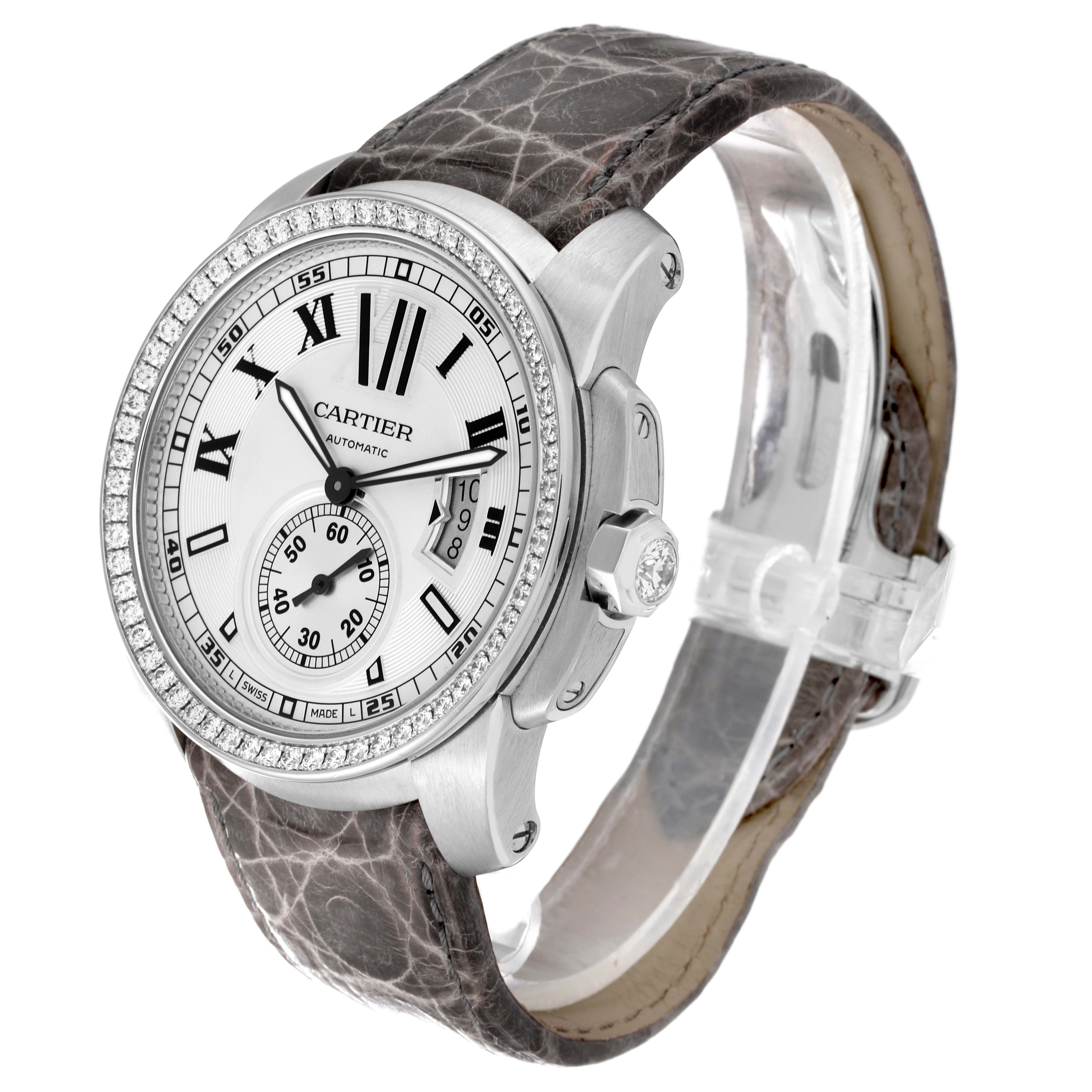 The Calibre de Cartier watch is shown at a three-quarter angle, displaying the face, bezel, crown, and leather strap.