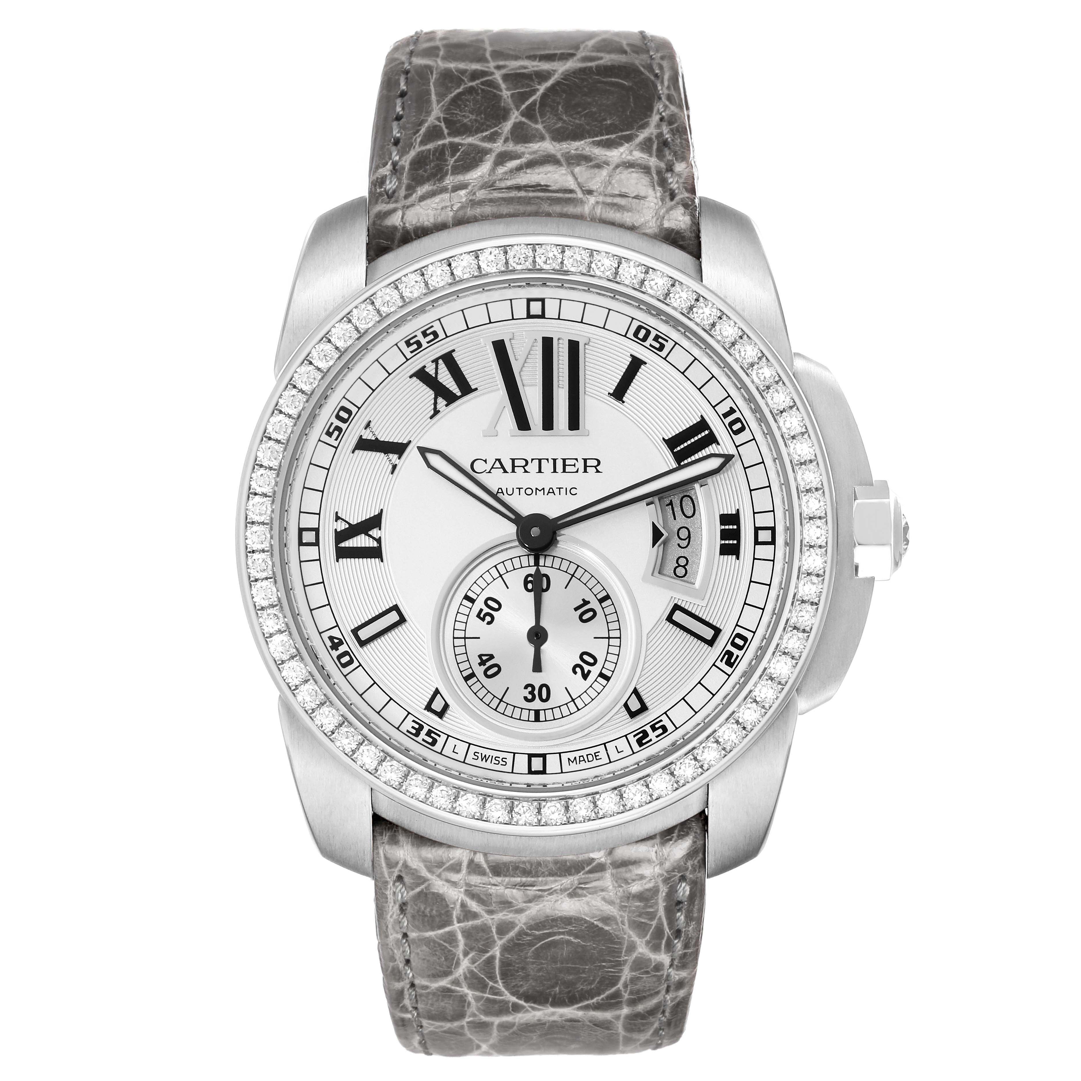 The Calibre de Cartier watch is shown from a front angle, displaying its face, bezel, crown, and leather strap.