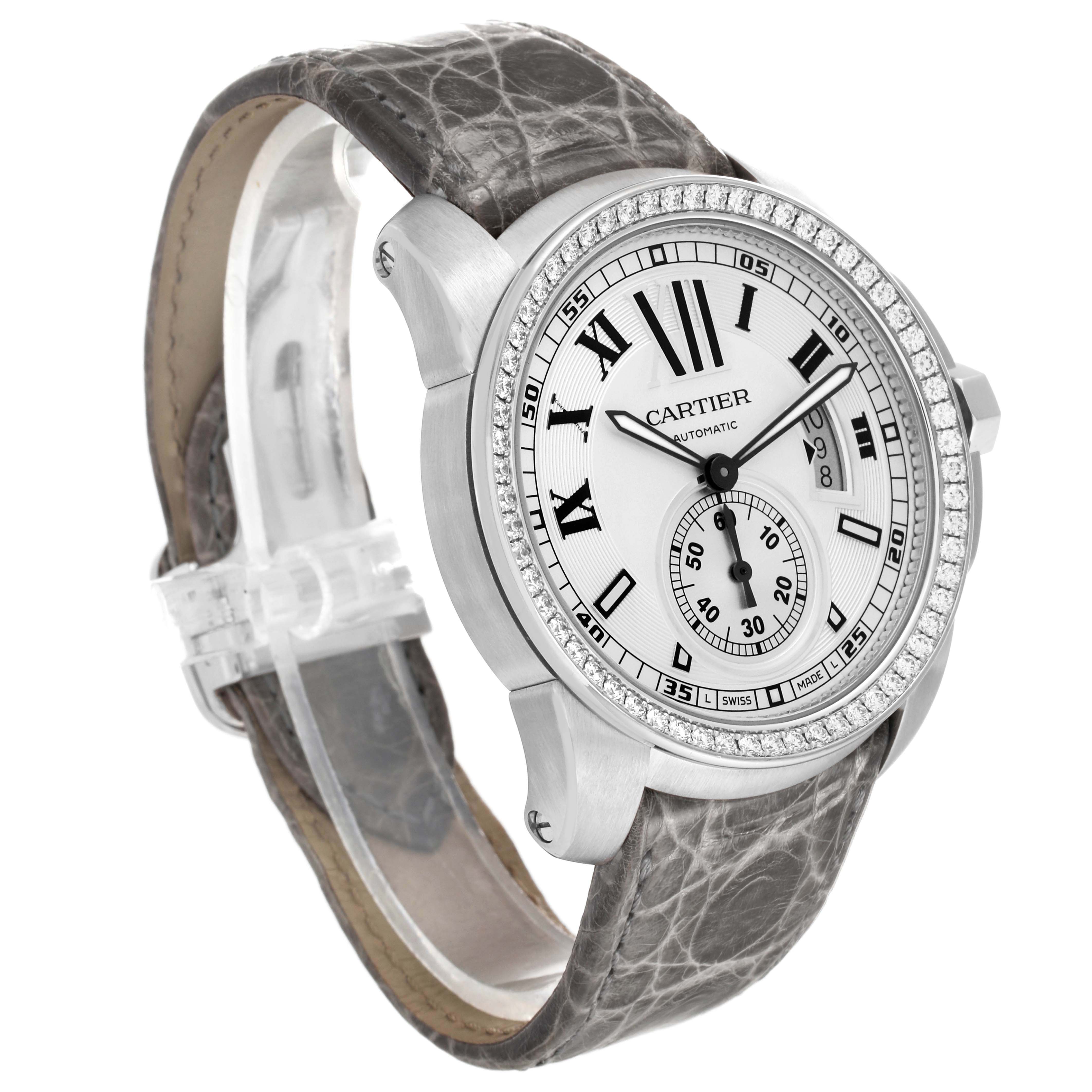The Calibre de Cartier watch is shown at an angled side view, displaying its bezel, dial, and leather strap.