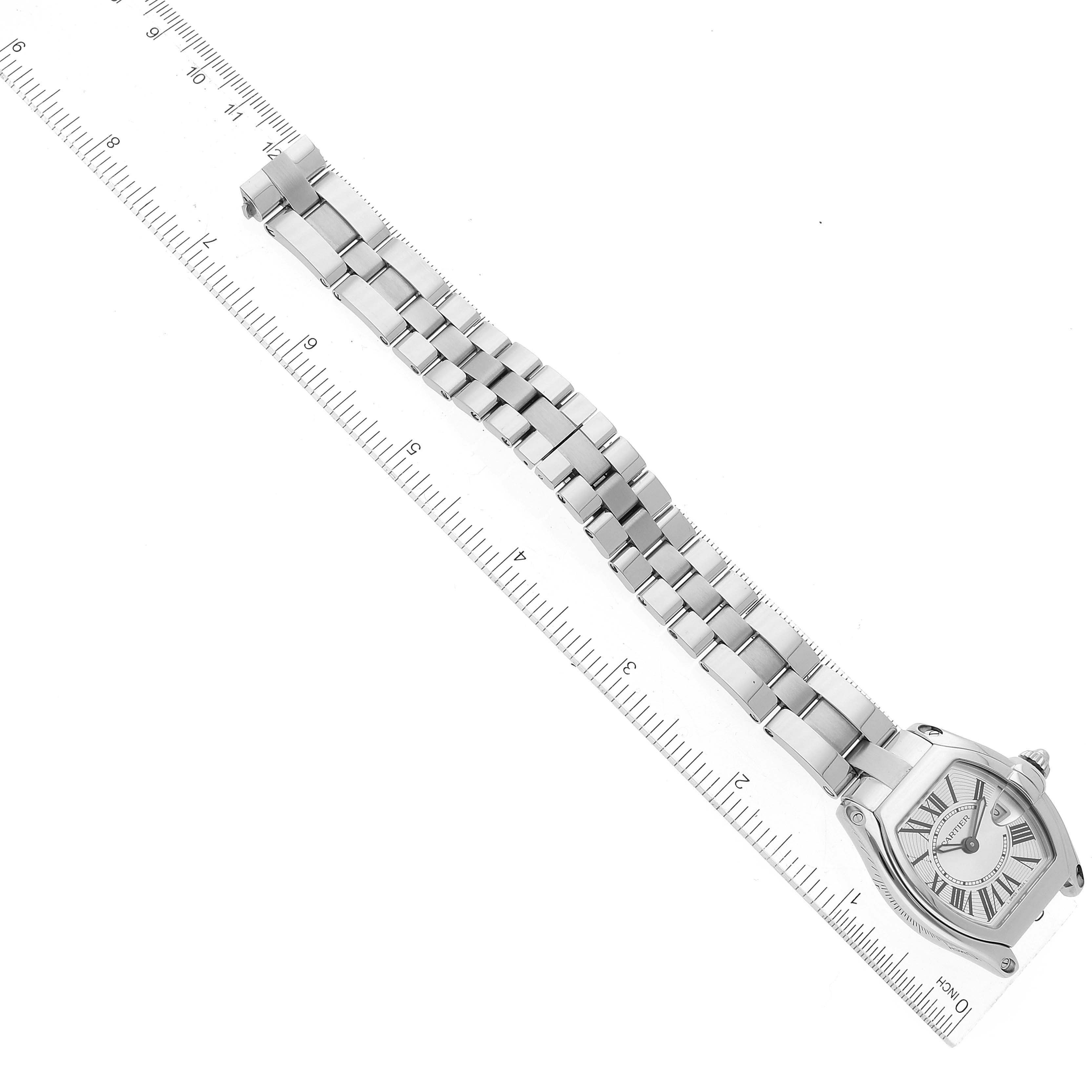 This image shows a top-down view of a Cartier Roadster W62016V3 Women's Steel and Gold (two tone) Silver Dial W62016V3 Women's Steel and Gold (two tone) Silver Dial model watch, including its bracelet aligned with a ruler.