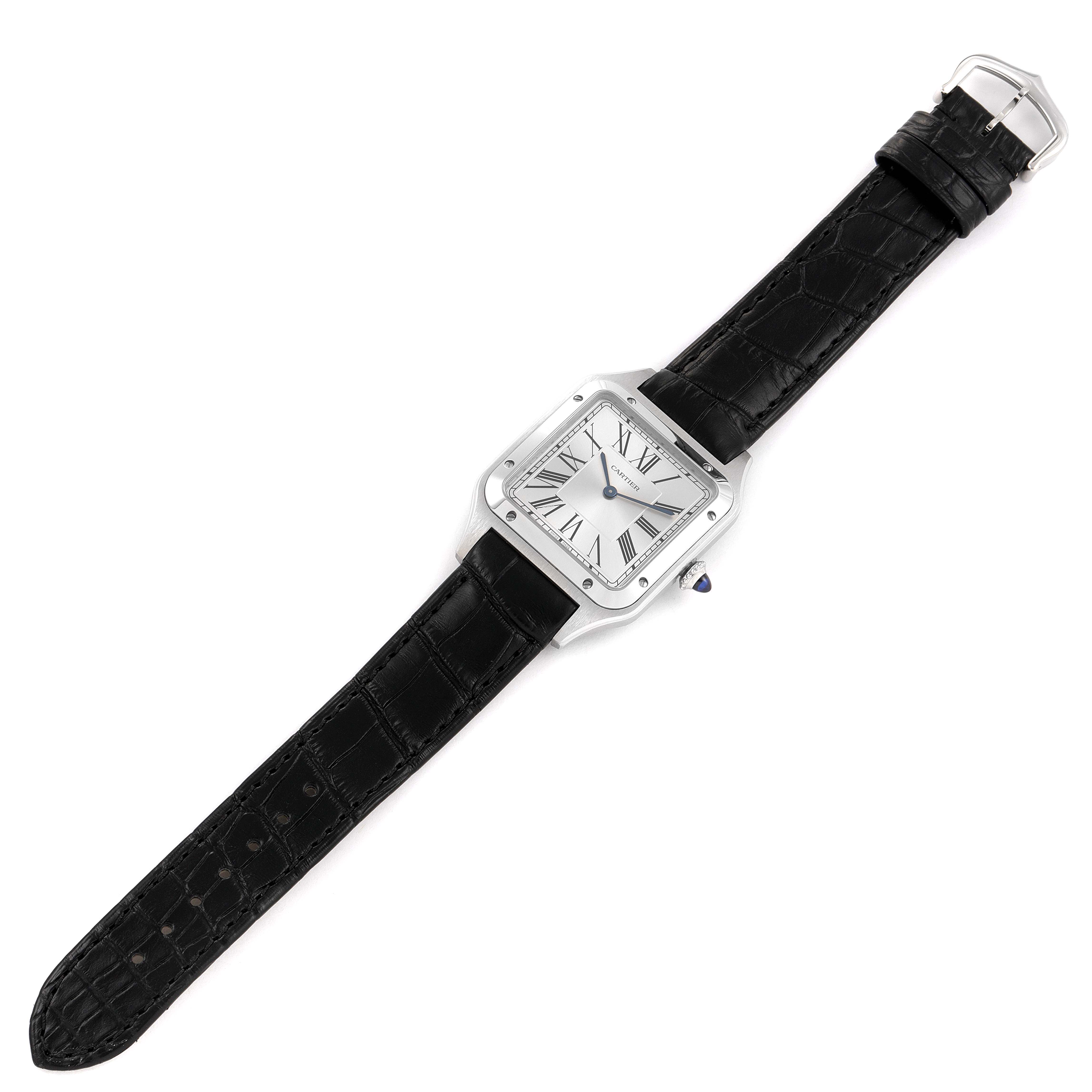 The Cartier Santos Dumont WSSA0022 Men's Stainless Steel Silver Dial WSSA0022 Men's Stainless Steel Silver Dial watch is shown from a top-down angle, featuring its black leather strap and square face with Roman numerals.