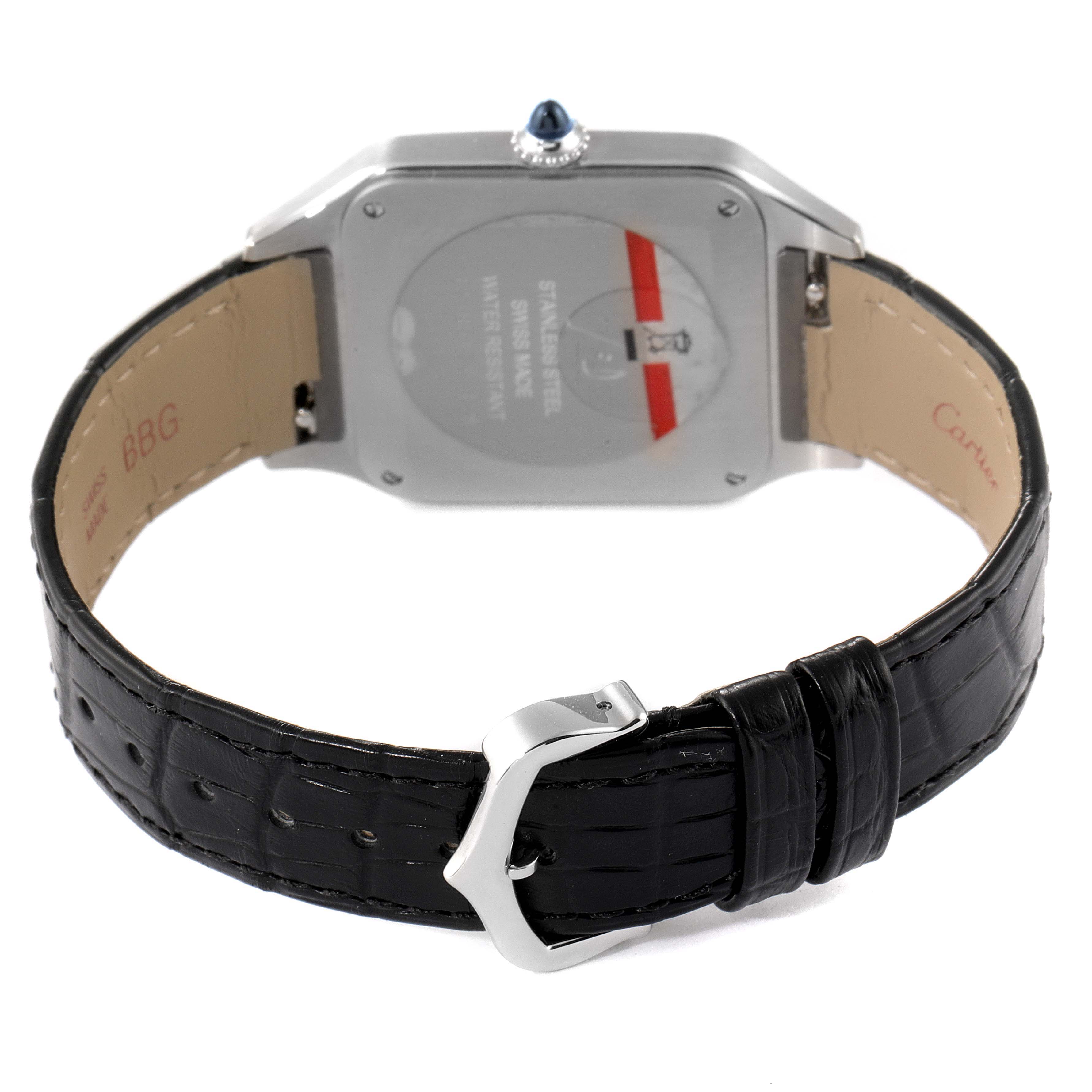 This image shows the back of the Cartier Santos Dumont WSSA0022 Men's Stainless Steel Silver Dial WSSA0022 Men's Stainless Steel Silver Dial watch and its black leather strap with a buckle.