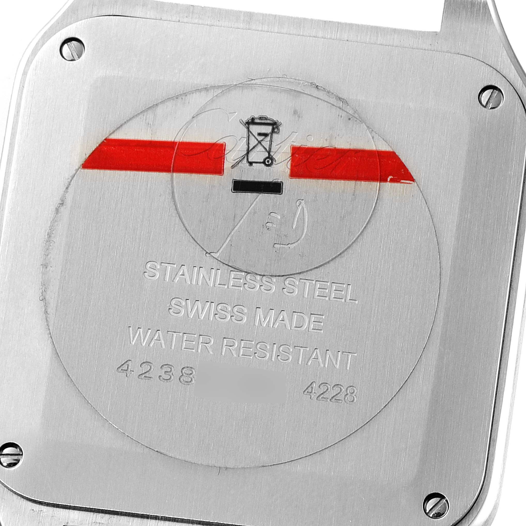 The image shows the back cover of a Cartier Santos Dumont WSSA0022 Men's Stainless Steel Silver Dial WSSA0022 Men's Stainless Steel Silver Dial watch, highlighting its stainless steel composition and water resistance.