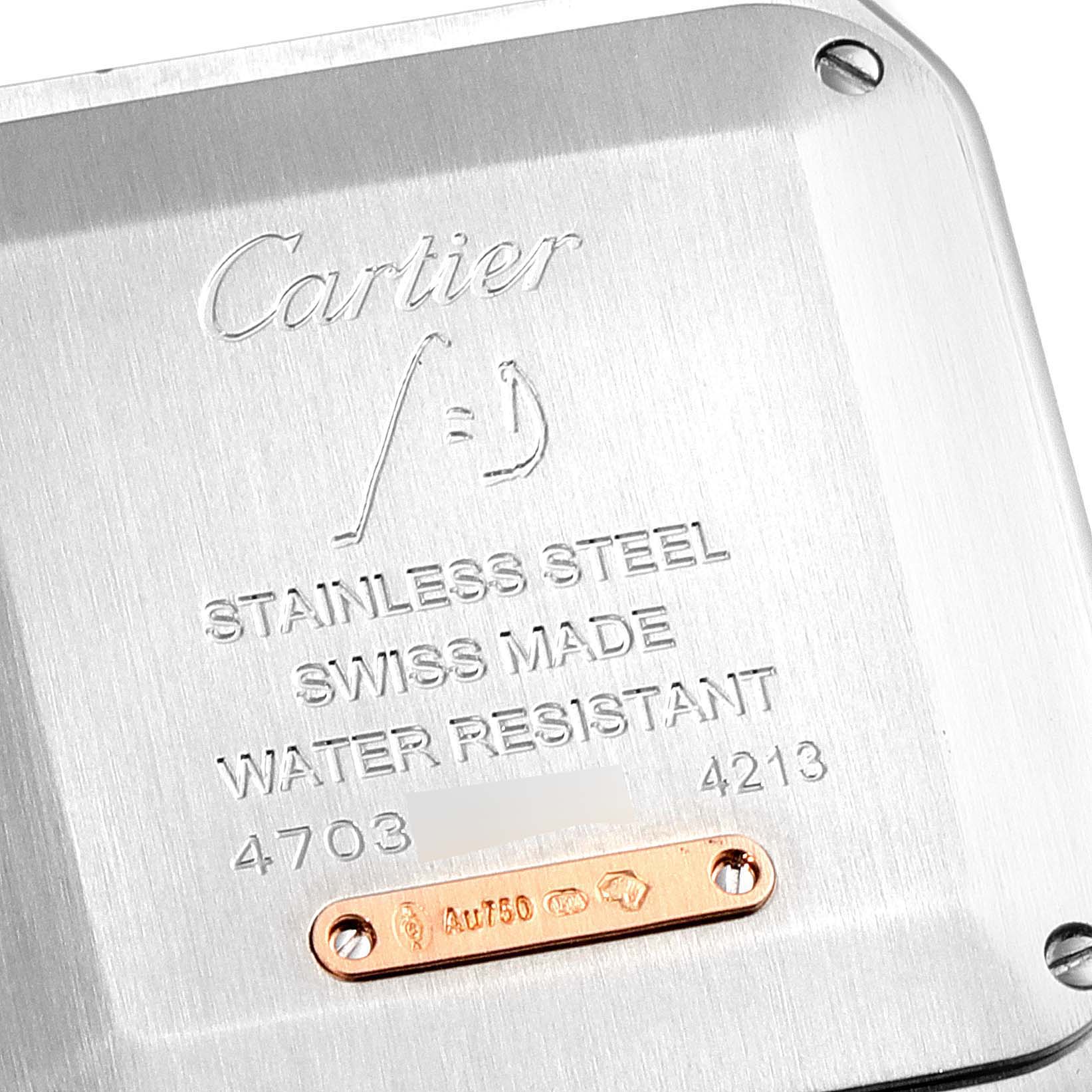 The image shows the backside of a Cartier Santos W2SA0012 Women's Steel and Gold (two tone) Silver Dial W2SA0012 Women's Steel and Gold (two tone) Silver Dial watch with inscriptions detailing its specifications.