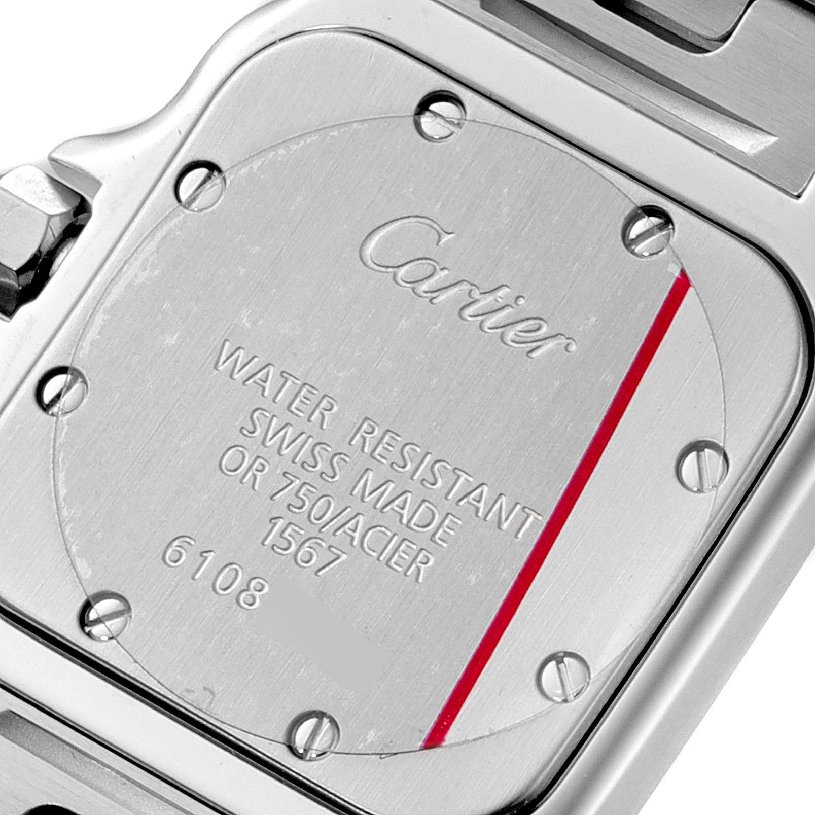 The image shows the back case of a Cartier Santos W20012C4 Women's Steel and Gold (two tone) Silver Dial W20012C4 Women's Steel and Gold (two tone) Silver Dial watch, featuring its engraved details and screw placements.