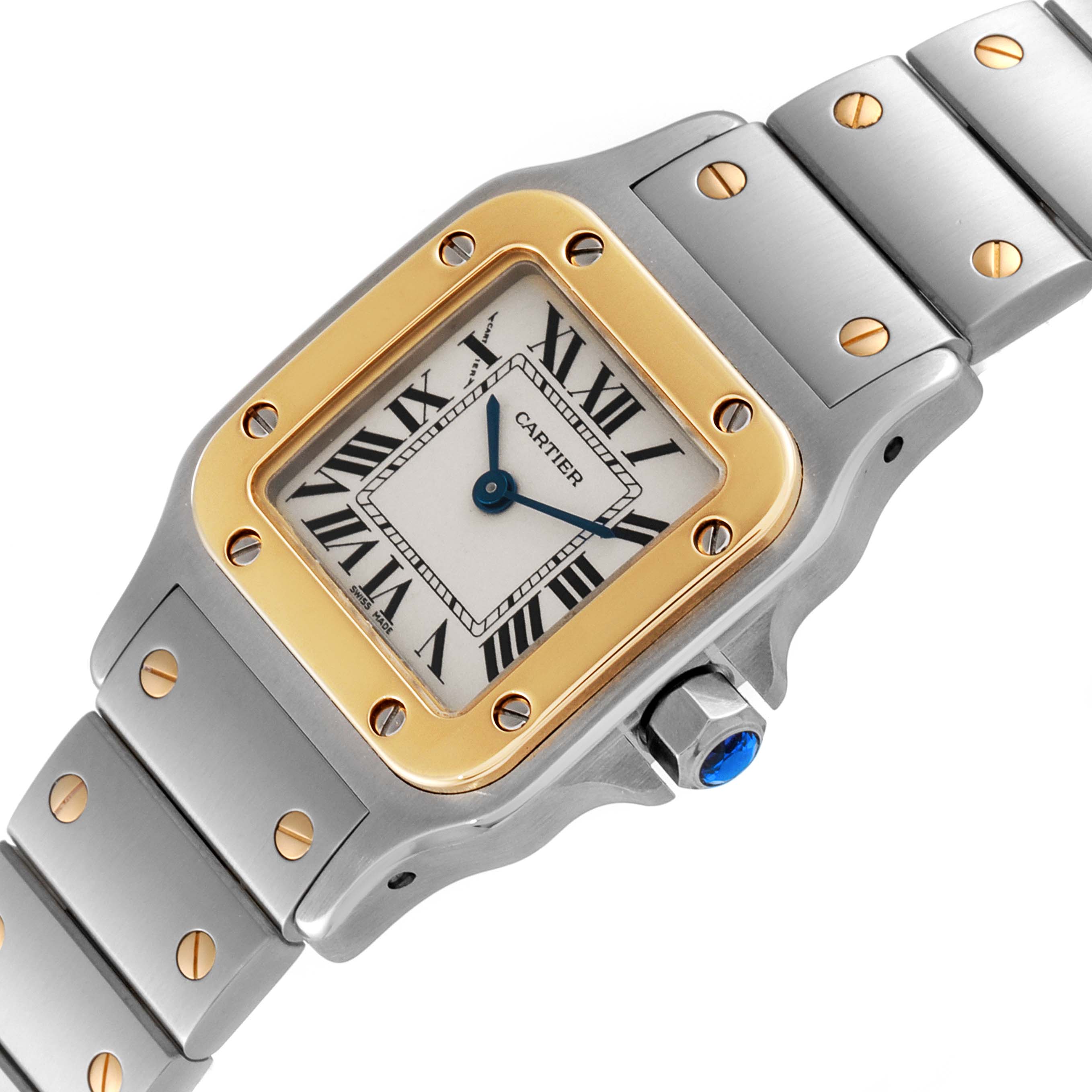 This image shows a close-up angle of the Cartier Santos W20012C4 Women's Steel and Gold (two tone) Silver Dial W20012C4 Women's Steel and Gold (two tone) Silver Dial model watch, focusing on the face, bezel, and part of the bracelet.