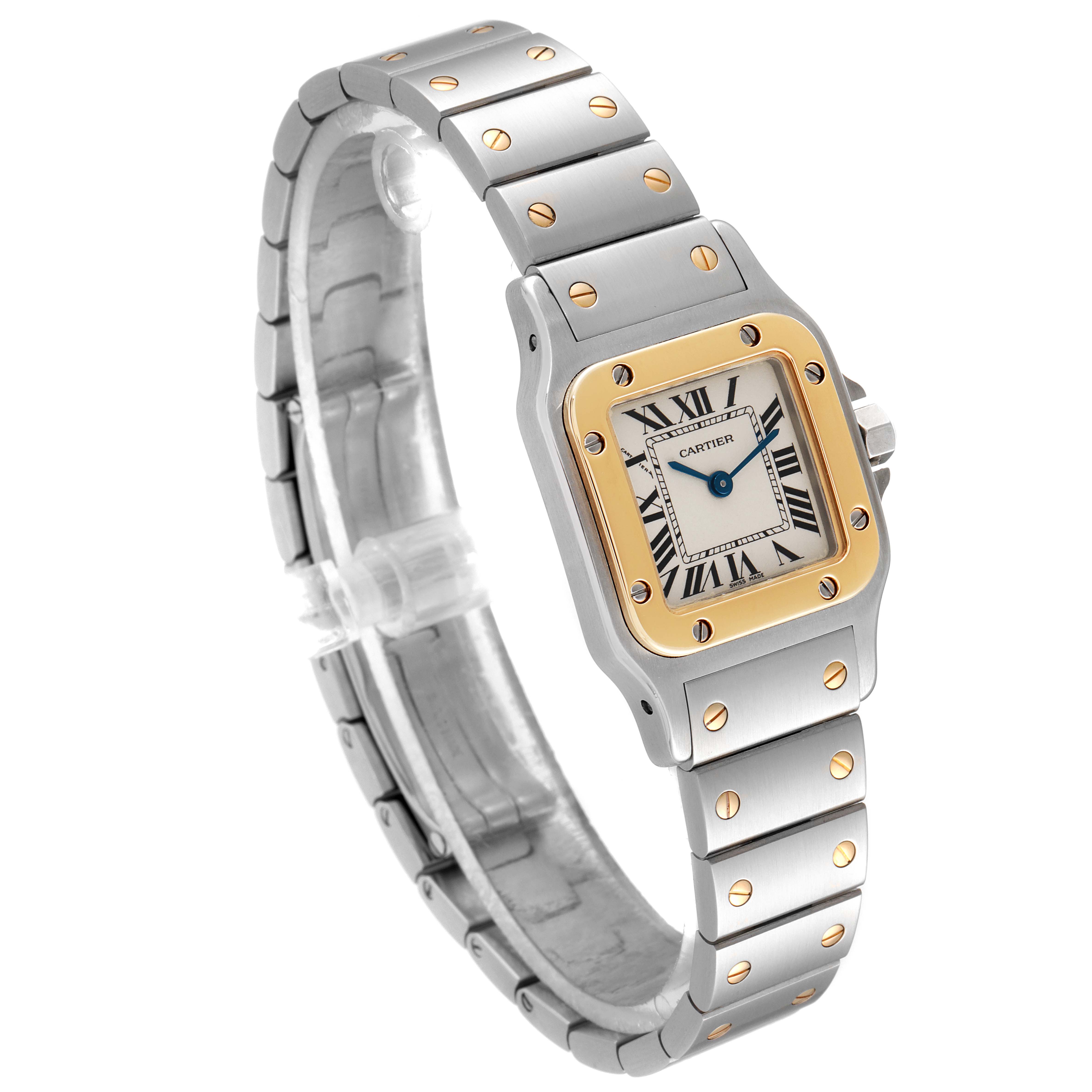 The image shows a side angle view of the Cartier Santos W20012C4 Women's Steel and Gold (two tone) Silver Dial W20012C4 Women's Steel and Gold (two tone) Silver Dial watch, highlighting the face, bezel, and bracelet.
