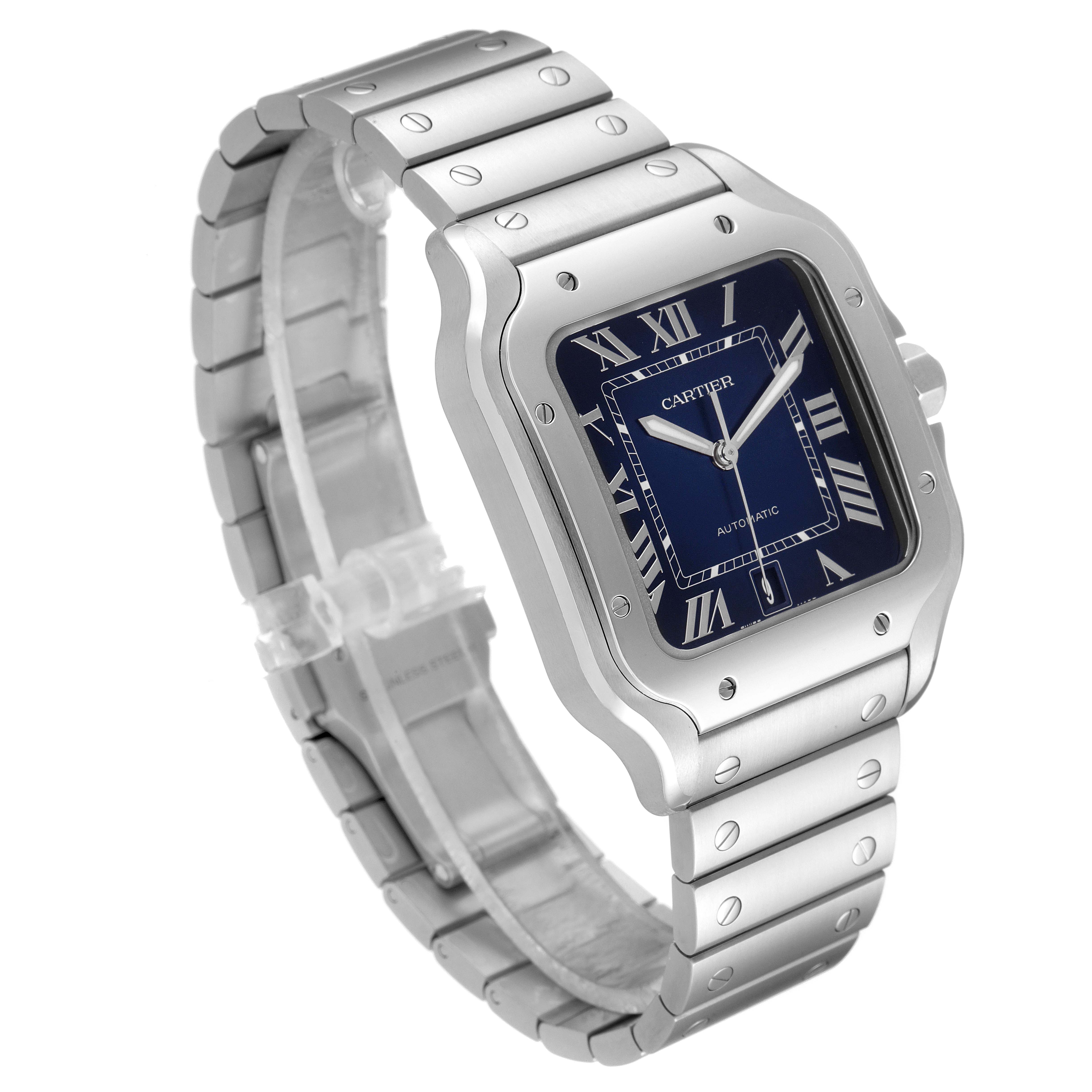 The image shows a side-angle view of the Santos by Cartier watch, highlighting its blue dial, metal bracelet, and square case.