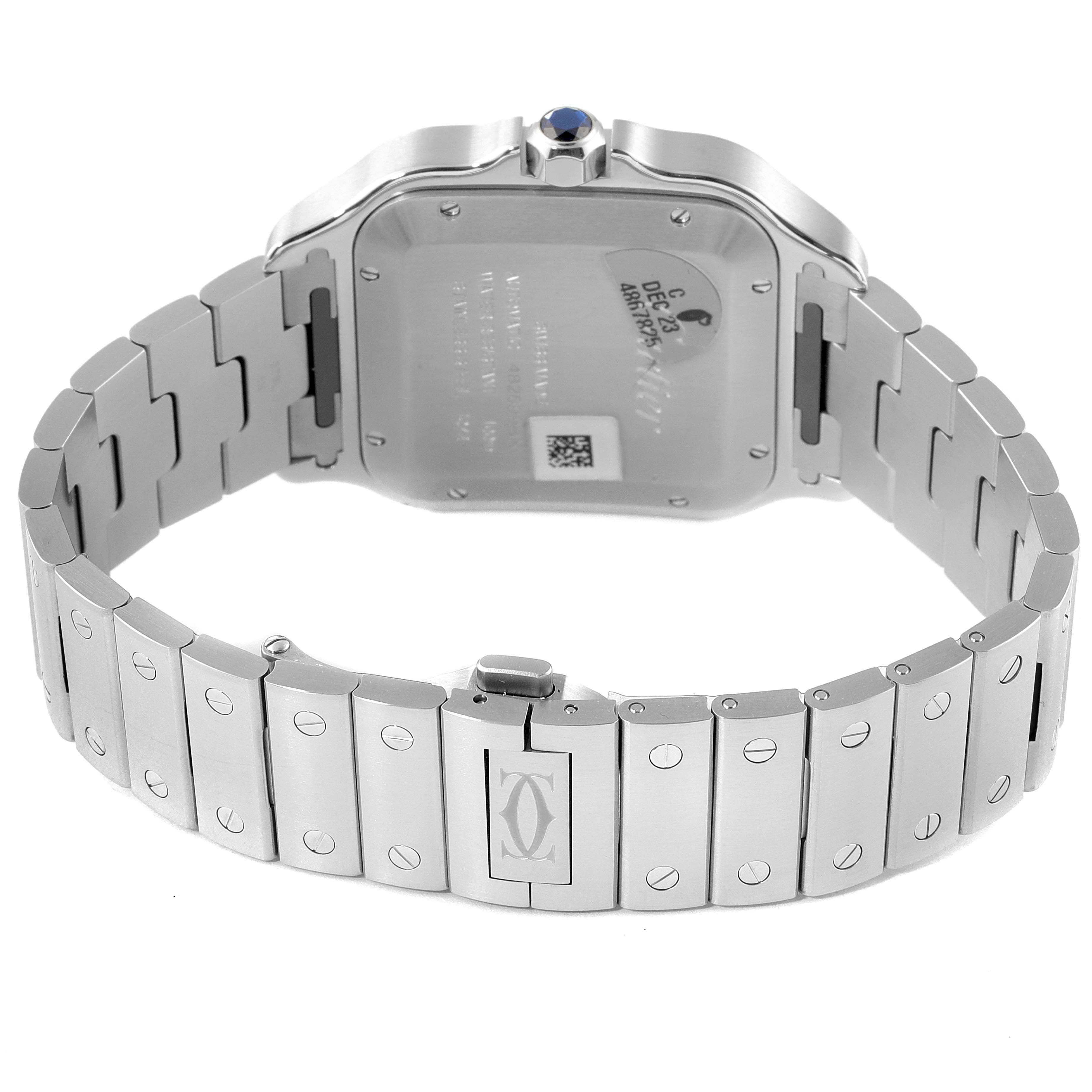 The image shows the back view of the Santos model by Cartier, focusing on the case back and metal bracelet.
