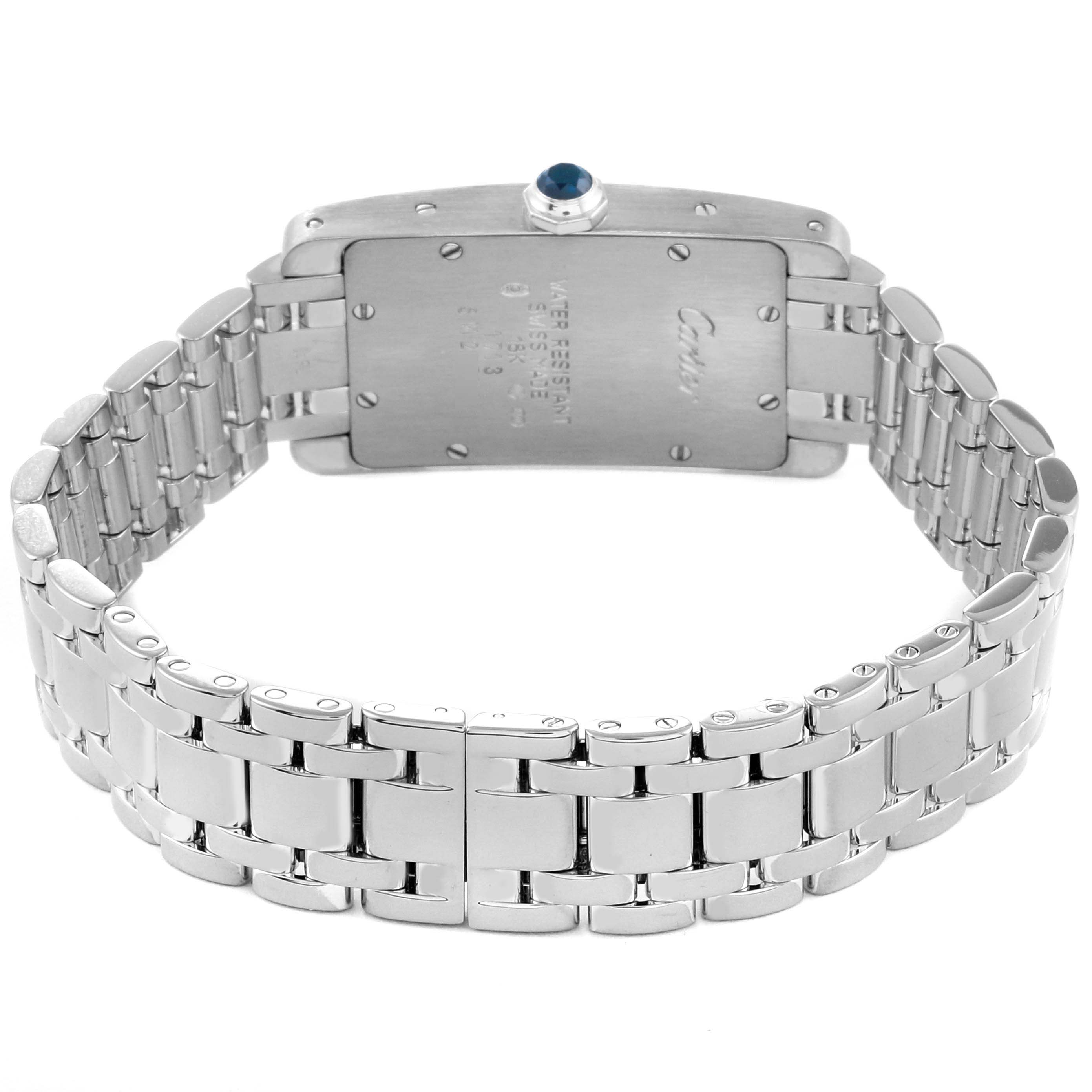 The image shows the back view of a Cartier Tank Americaine W26019L1 Women
s White Gold Silver Dial W26019L1 Women
s White Gold Silver Dial watch, highlighting its stainless steel bracelet and case back.
