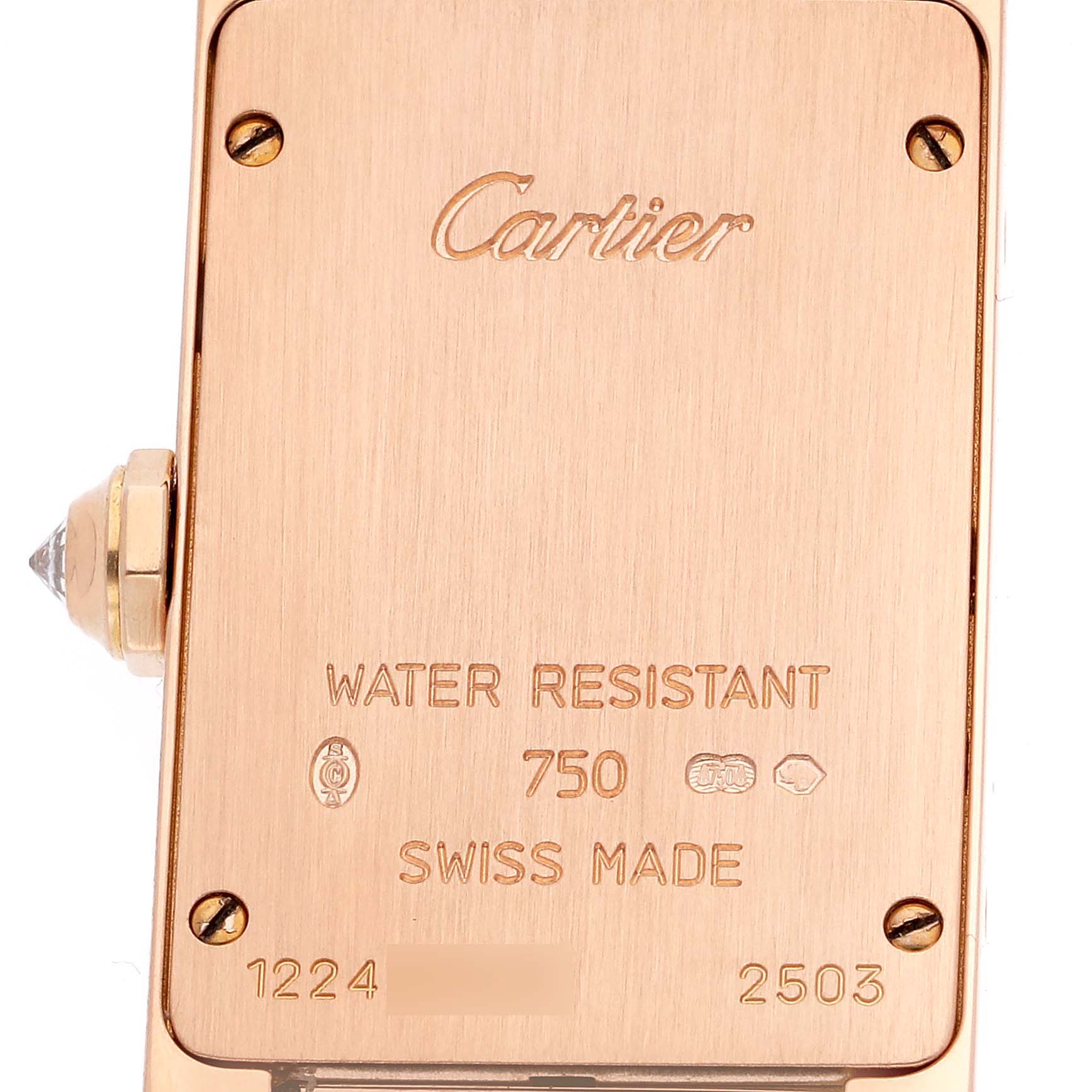 This image shows the back case of the Cartier Tank Americaine WJTA0002 Women's Rose Gold Silver Dial WJTA0002 Women's Rose Gold Silver Dial watch in rose gold, highlighting the brand inscription and specifications.