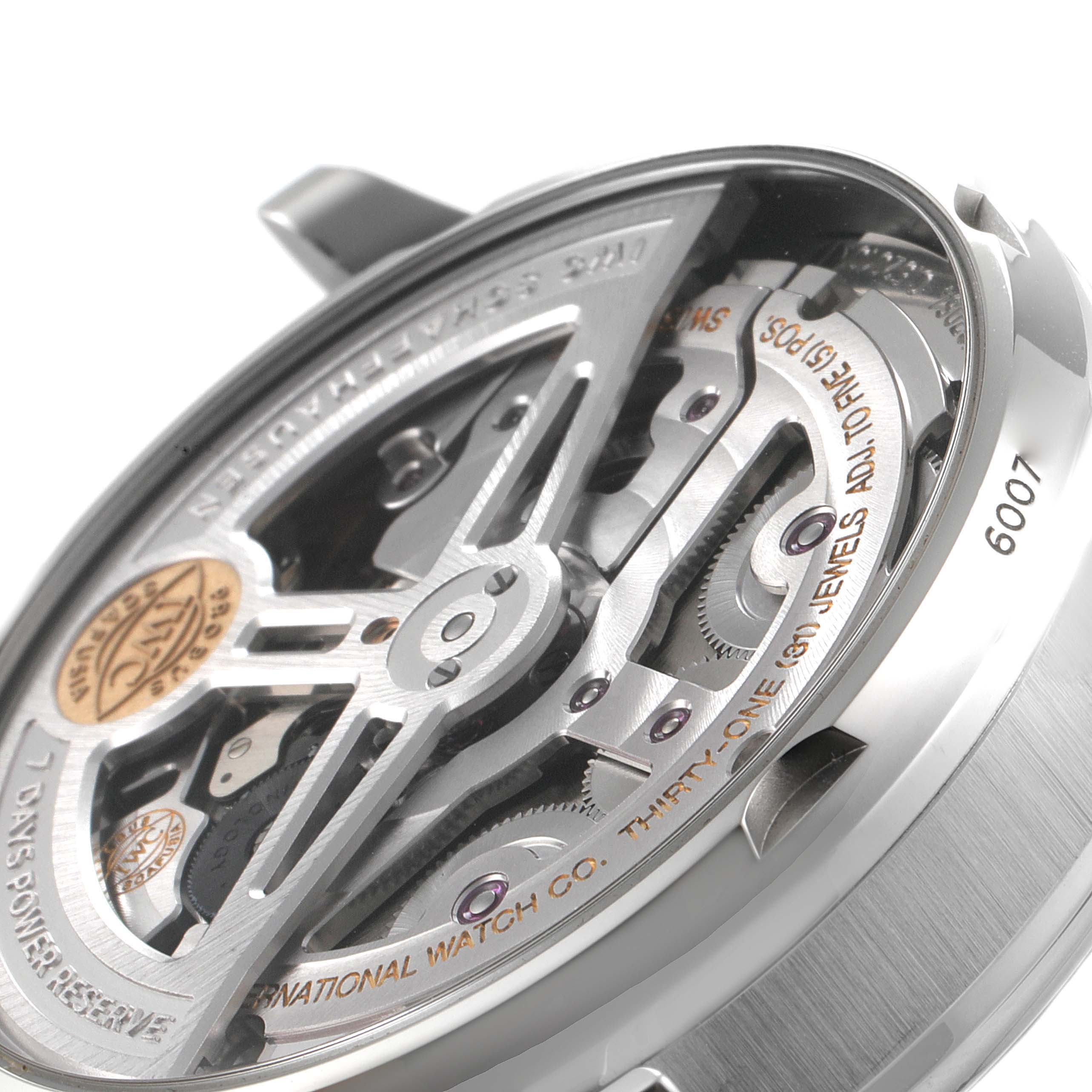 This image shows a detailed close-up of the movement and internal mechanics of the IWC Portuguese IW500704 Men's Stainless Steel Silver Dial IW500704 Men's Stainless Steel Silver Dial watch from an angled perspective.
