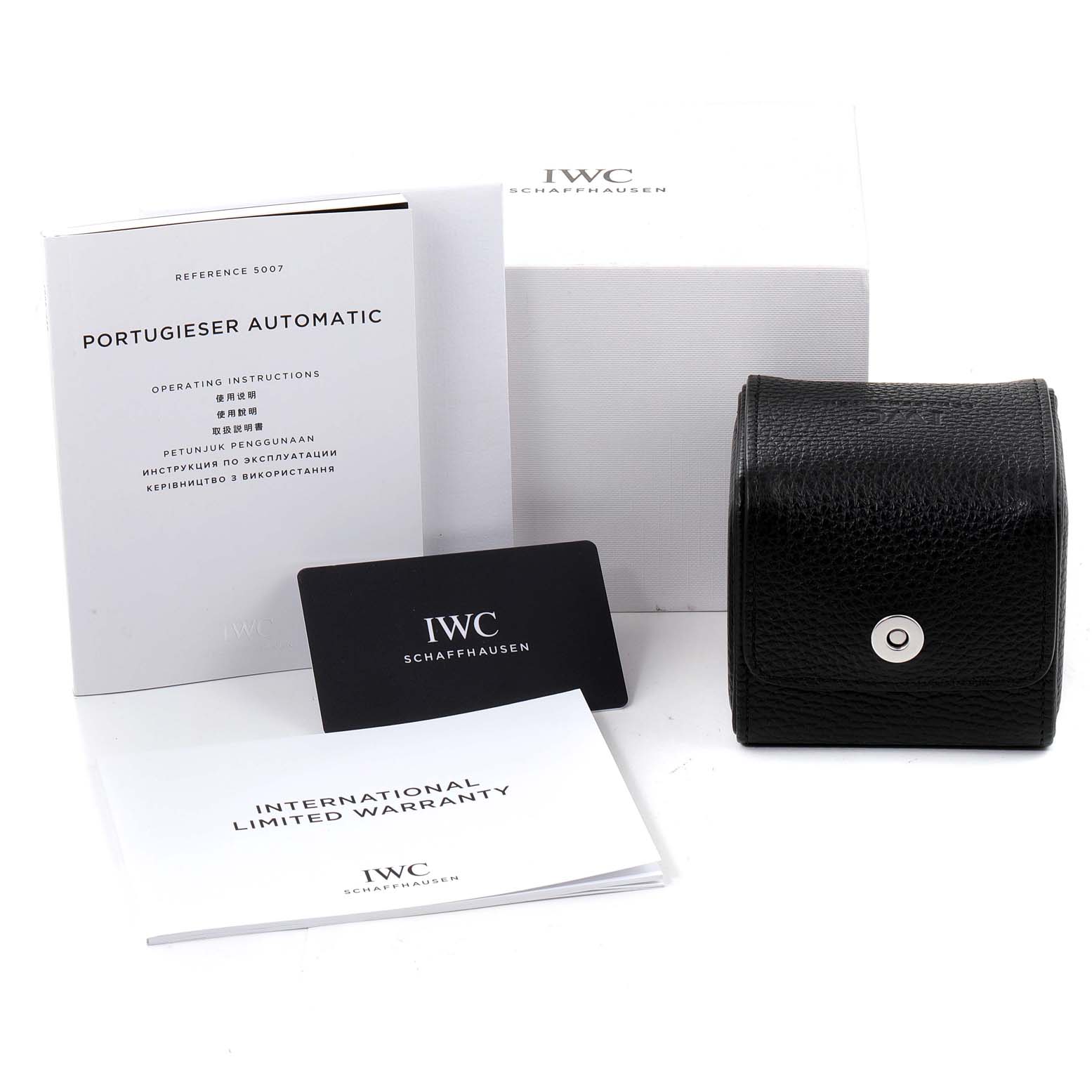 The image shows the packaging, warranty card, operating instructions, and a travel pouch for the IWC Portuguese IW500704 Men's Stainless Steel Silver Dial IW500704 Men's Stainless Steel Silver Dial model watch.