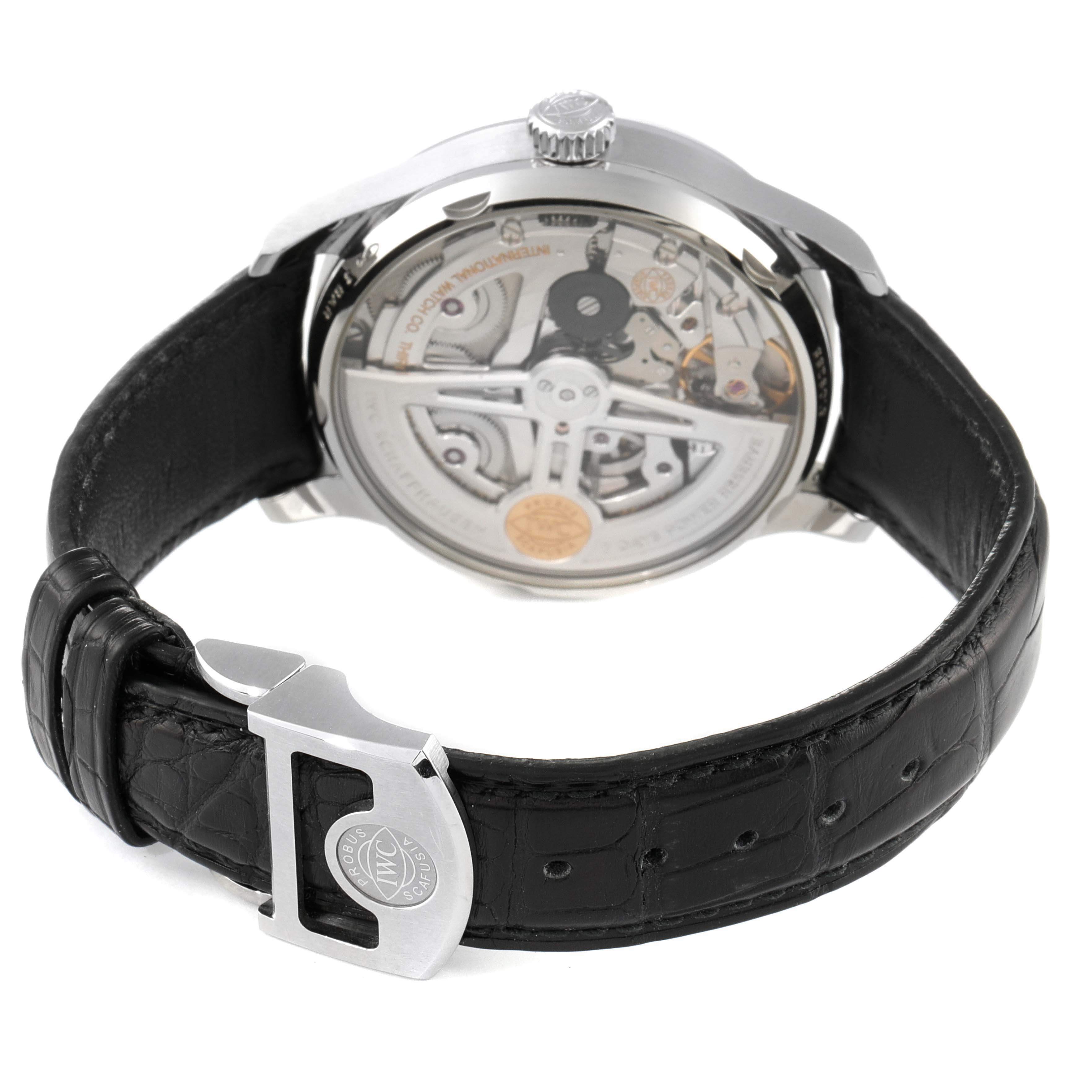 This image shows the back and strap of an IWC Portuguese IW500712 Men's Stainless Steel Silver Dial IW500712 Men's Stainless Steel Silver Dial model, showcasing its inner mechanics and black leather band.