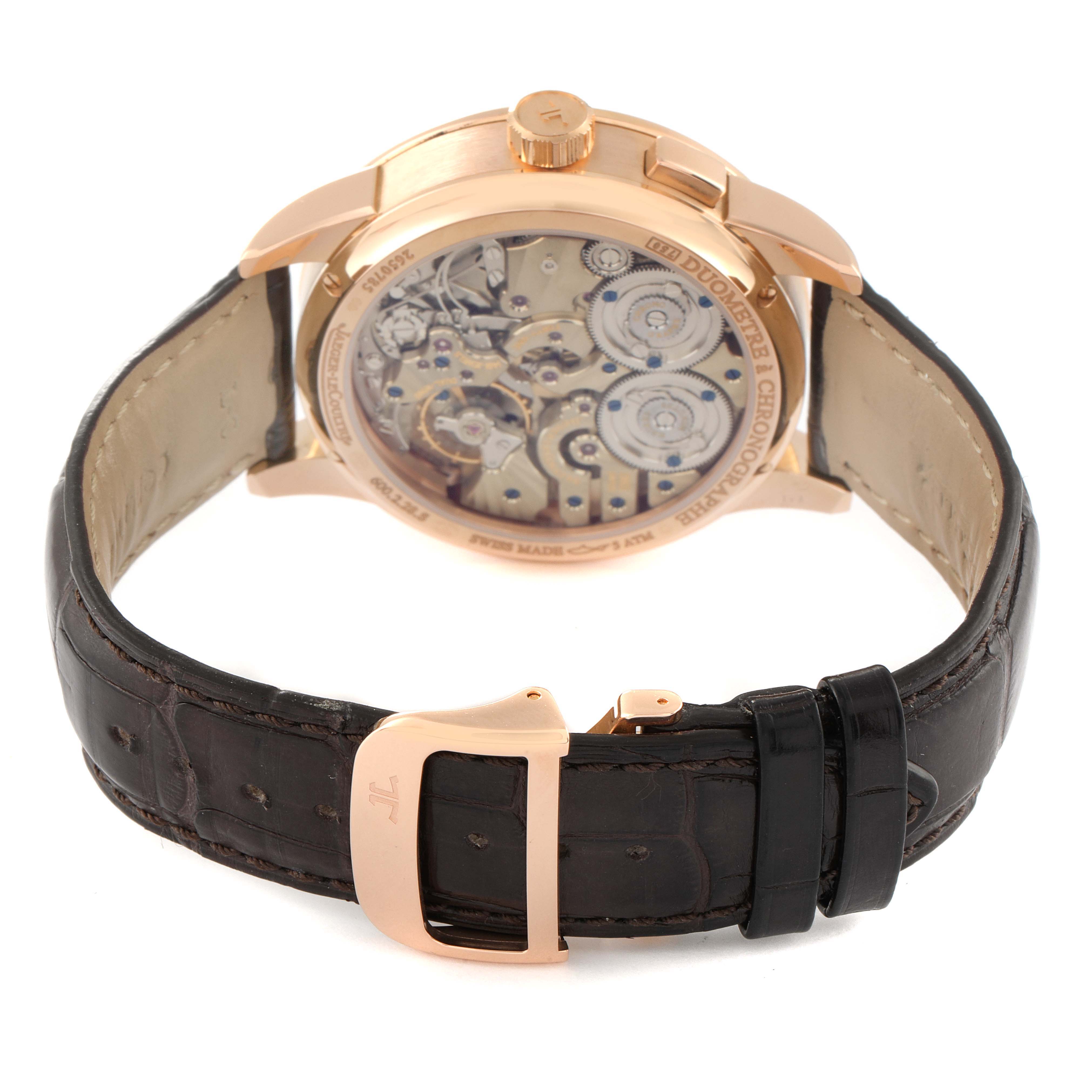 This image shows the back of a Jaeger LeCoultre Duometre Q6012420 Men's Rose Gold Silver Dial Q6012420 Men's Rose Gold Silver Dial watch, featuring its intricate movement and leather strap with a rose gold buckle.