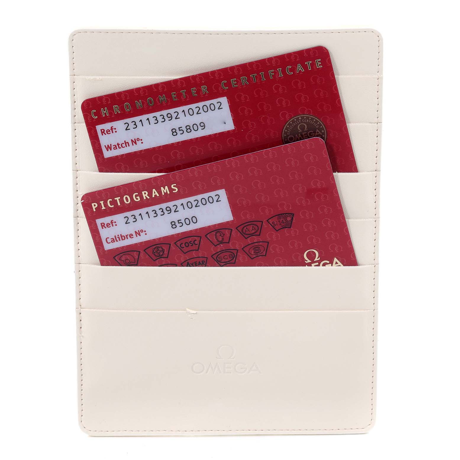 The image shows two certification cards in a white Omega holder for the Aqua Terra model.