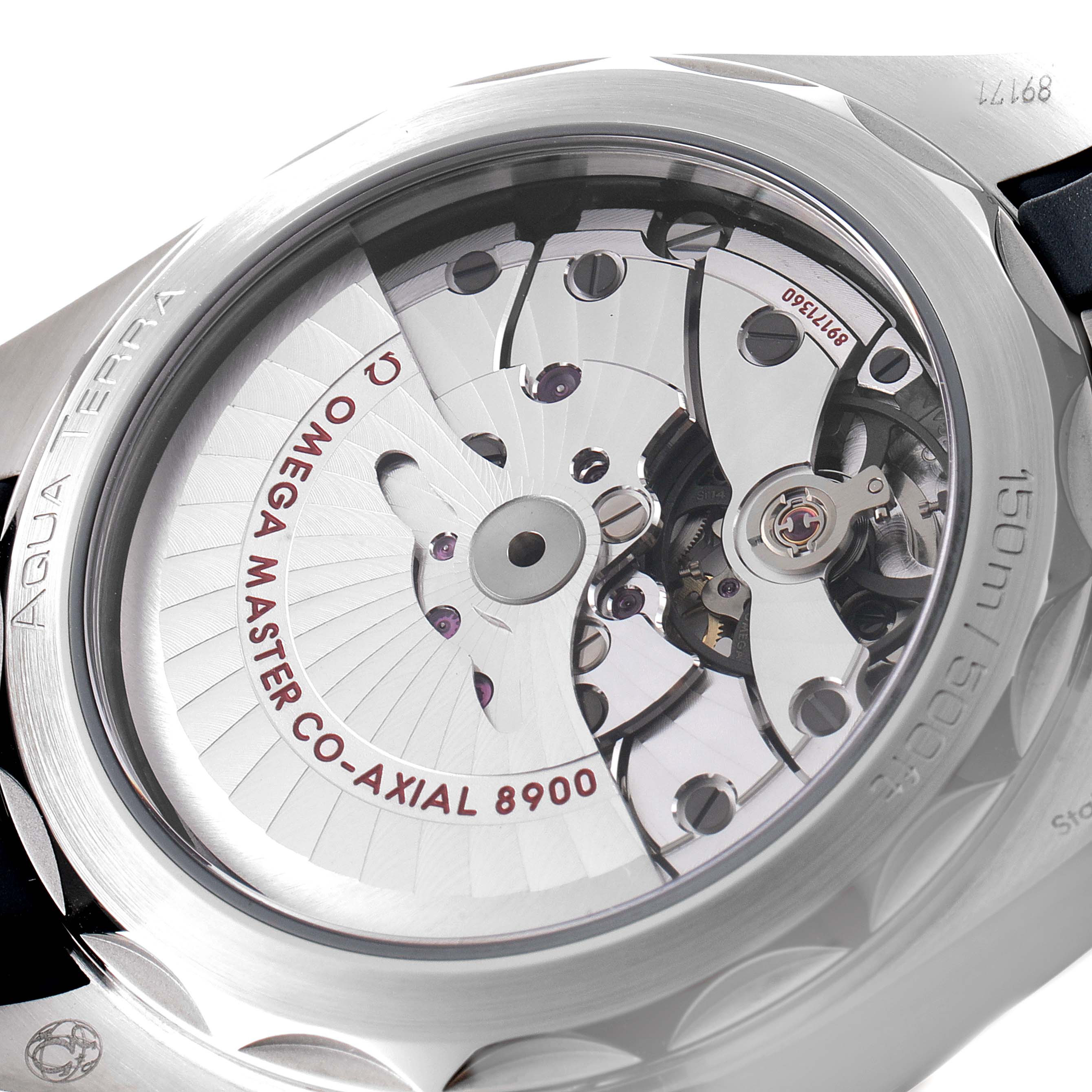 The image shows a close-up of the Omega Aqua Terra 220.12.41.21.03.002 Men
s Stainless Steel Blue Dial 220.12.41.21.03.002 Men
s Stainless Steel Blue Dial watch case back, highlighting the intricate movement and 
OMEGA MASTER CO-AXIAL 8900
 text.