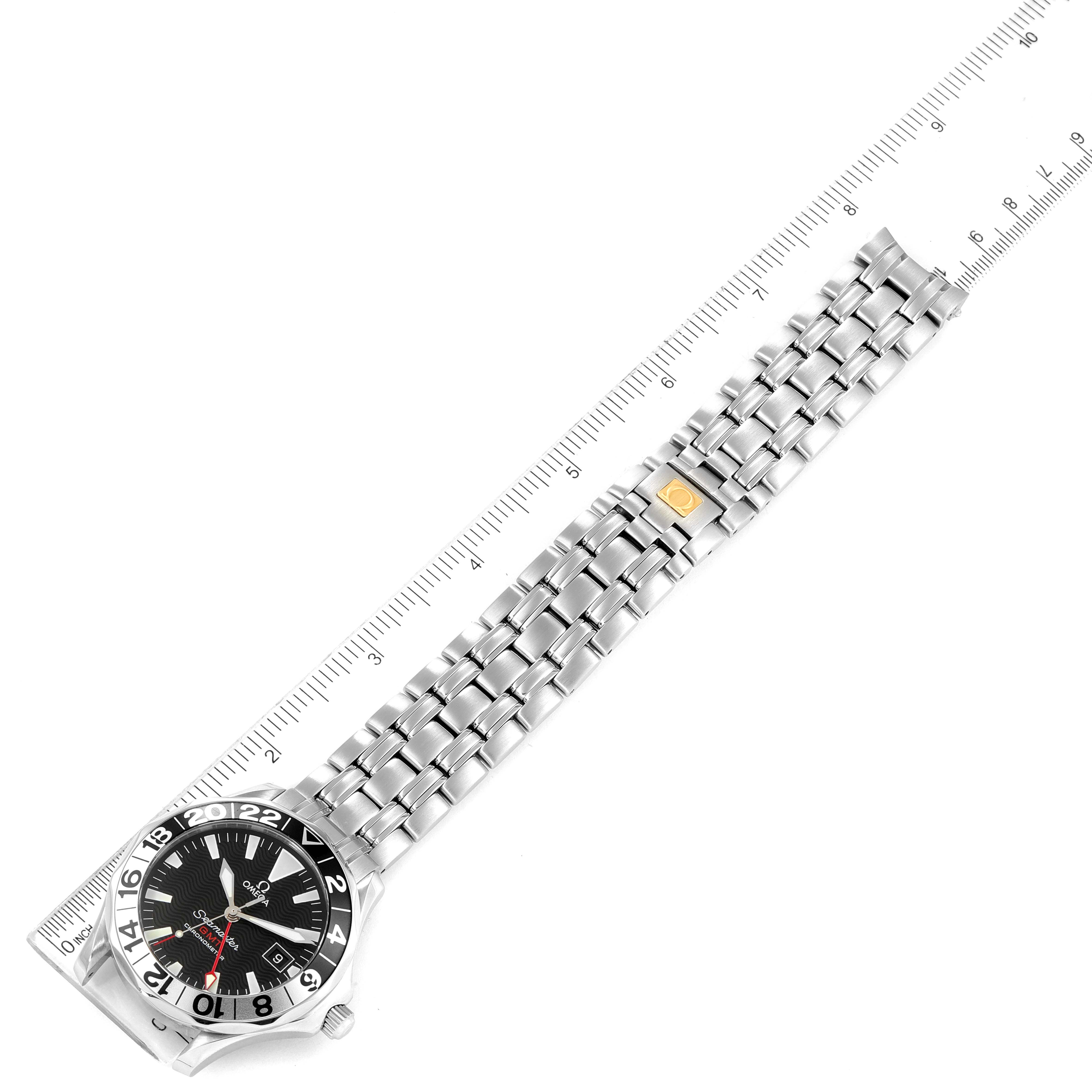 The image shows the Omega Seamaster 2534.50.00 Men's Stainless Steel Black Dial 2534.50.00 Men's Stainless Steel Black Dial watch laying flat, with a ruler measuring its stainless steel bracelet.