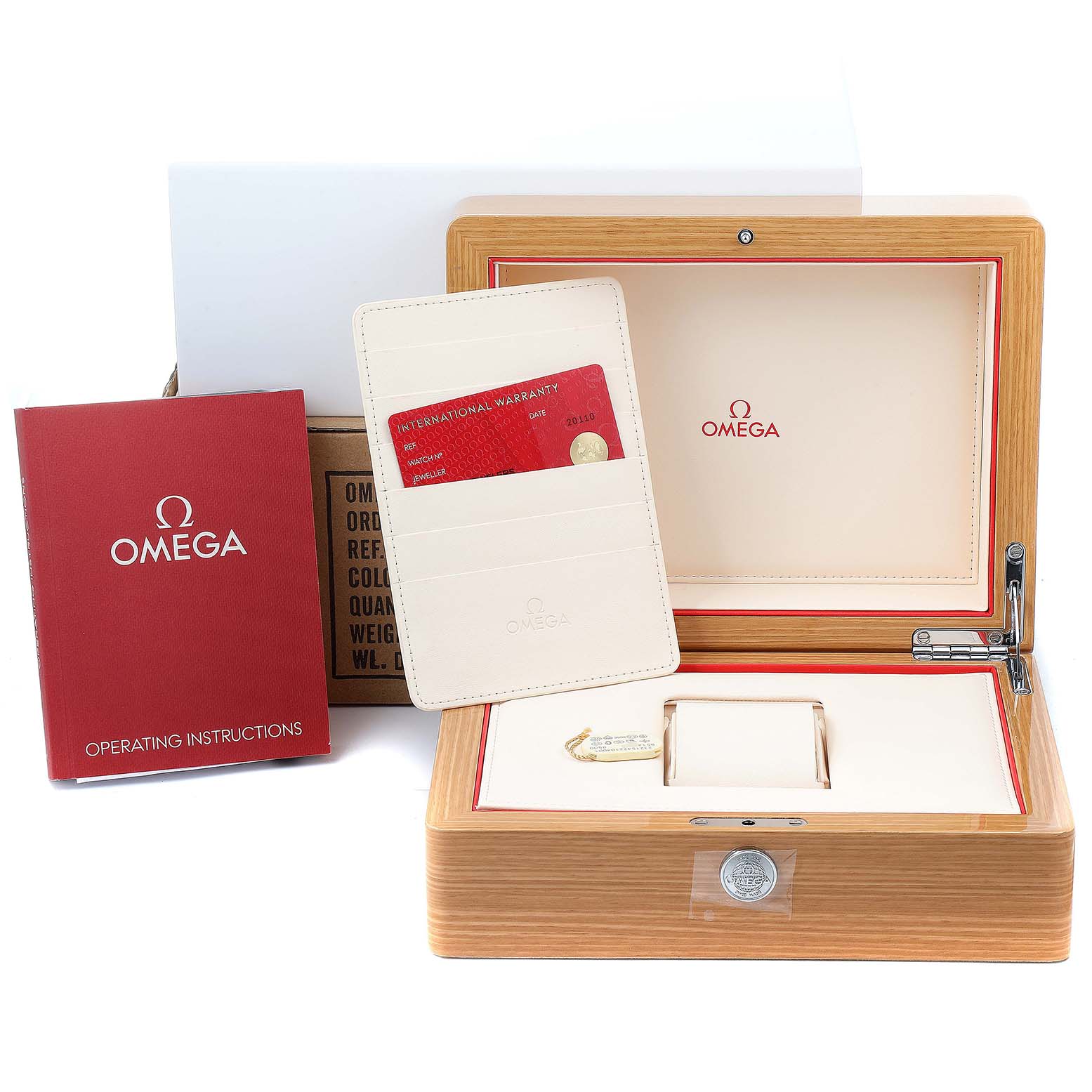 The image shows the box, operating instructions, warranty card, and holder for the Omega Planet Ocean 232.15.42.21.04.001 Men
s Stainless Steel White Dial 232.15.42.21.04.001 Men
s Stainless Steel White Dial watch from a front angle.