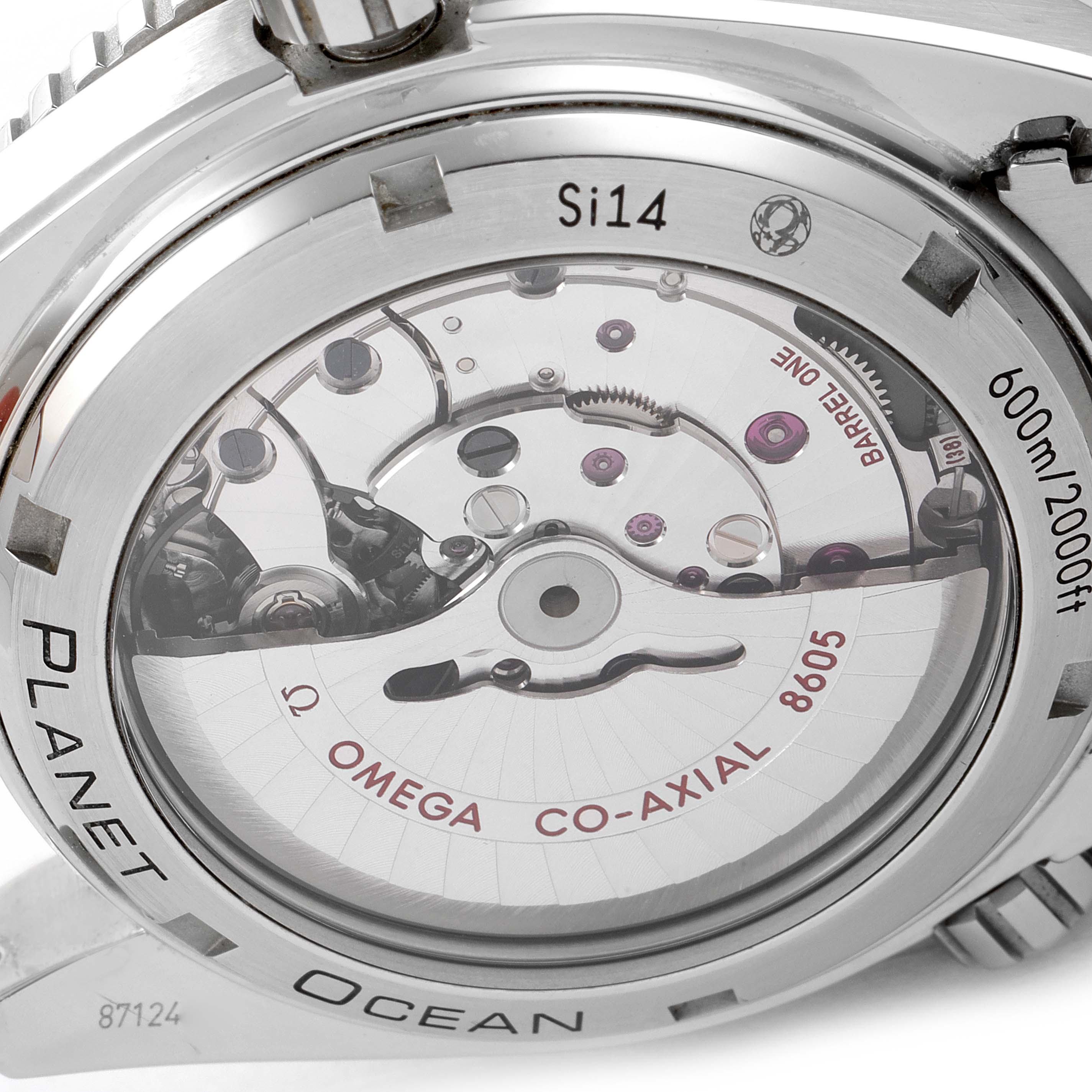 The image shows the back view of an Omega Planet Ocean 232.30.44.22.01.001 Men's Stainless Steel Black Dial 232.30.44.22.01.001 Men's Stainless Steel Black Dial watch, highlighting the internal mechanism and "Si14" marker.