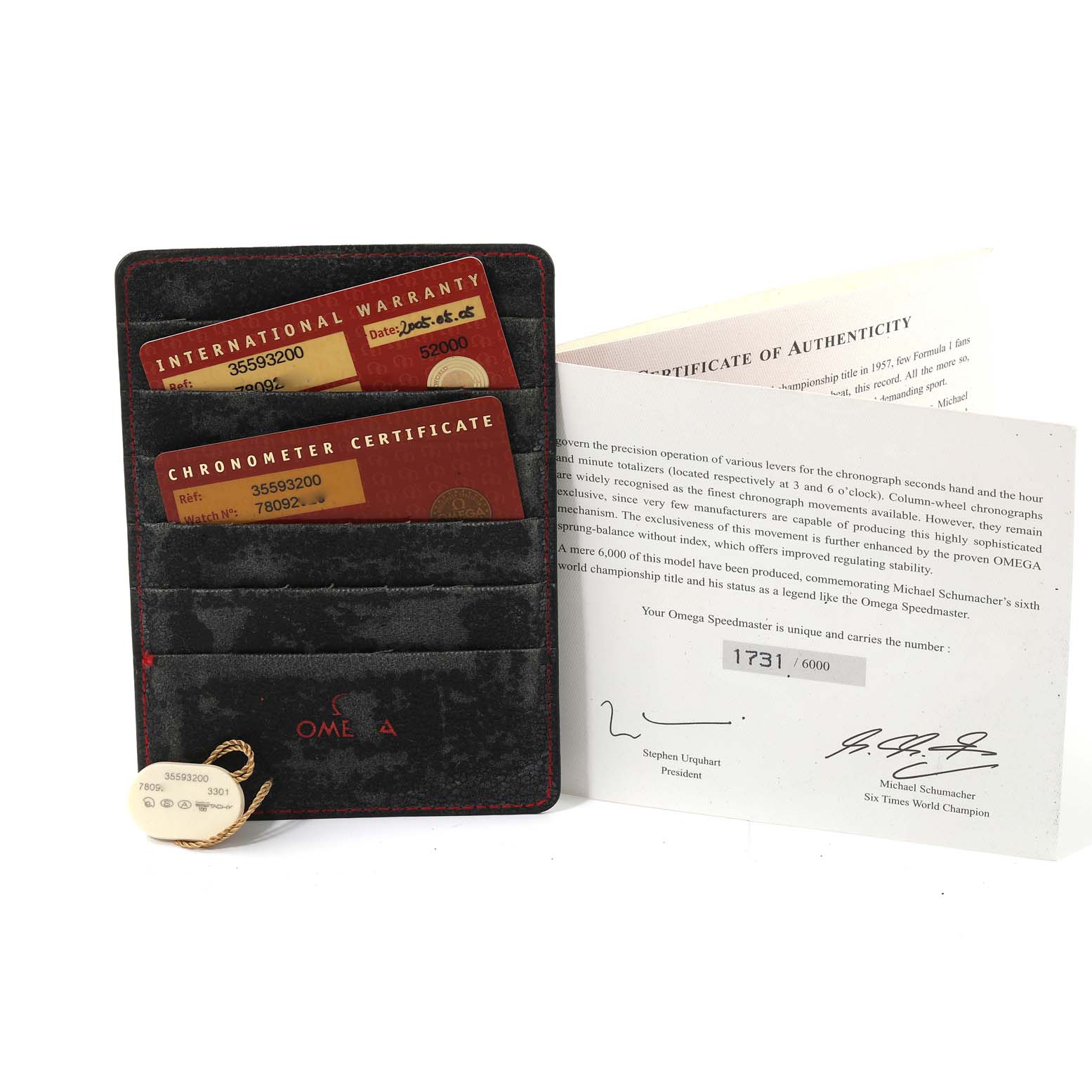 The image shows warranty cards, a certificate holder, and a certificate of authenticity for an Omega Speedmaster 3559.32.00 Men's Stainless Steel Silver Dial 3559.32.00 Men's Stainless Steel Silver Dial watch.