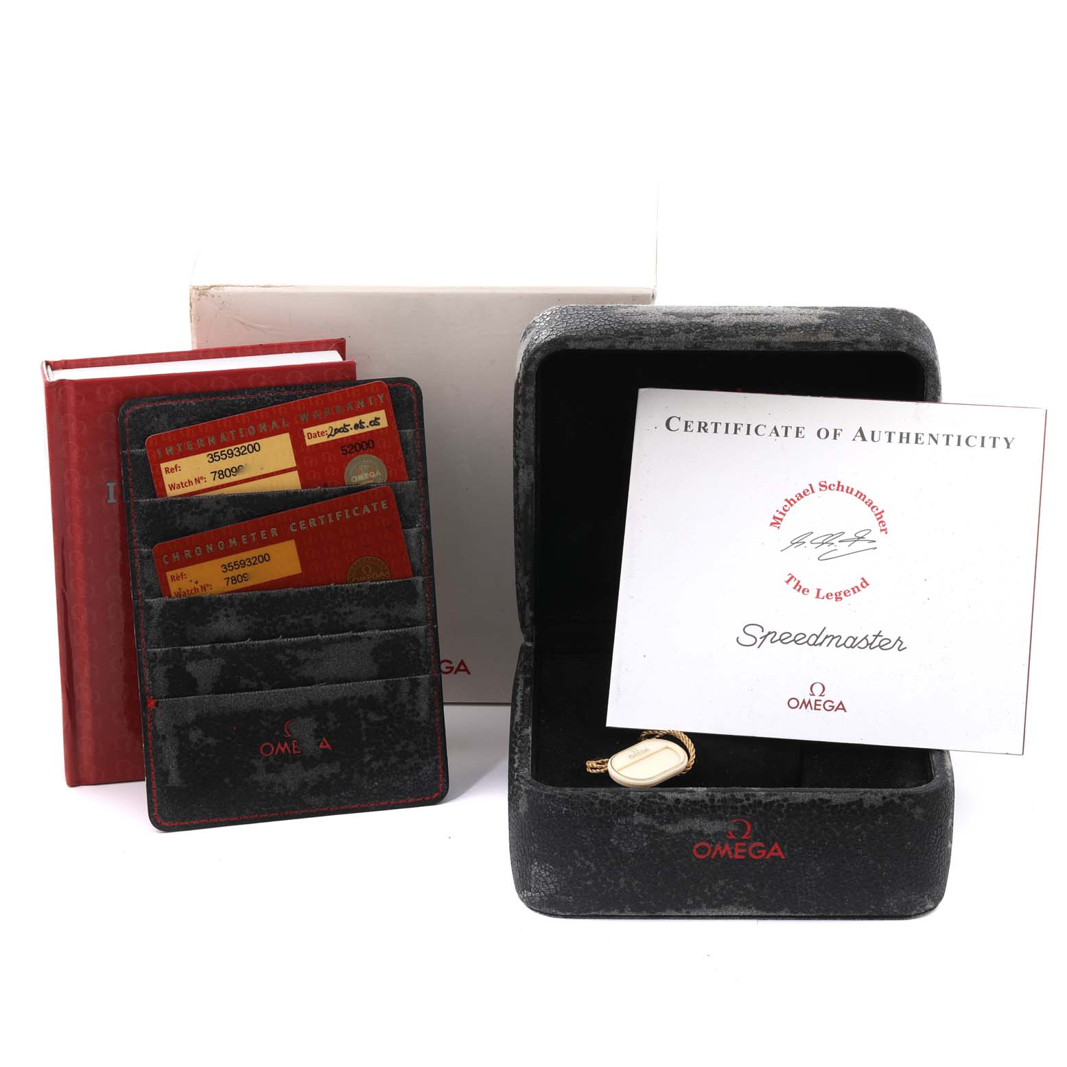 The image shows the Omega Speedmaster 3559.32.00 Men's Stainless Steel Silver Dial 3559.32.00 Men's Stainless Steel Silver Dial's box, certificate of authenticity, and accompanying documents and cards.