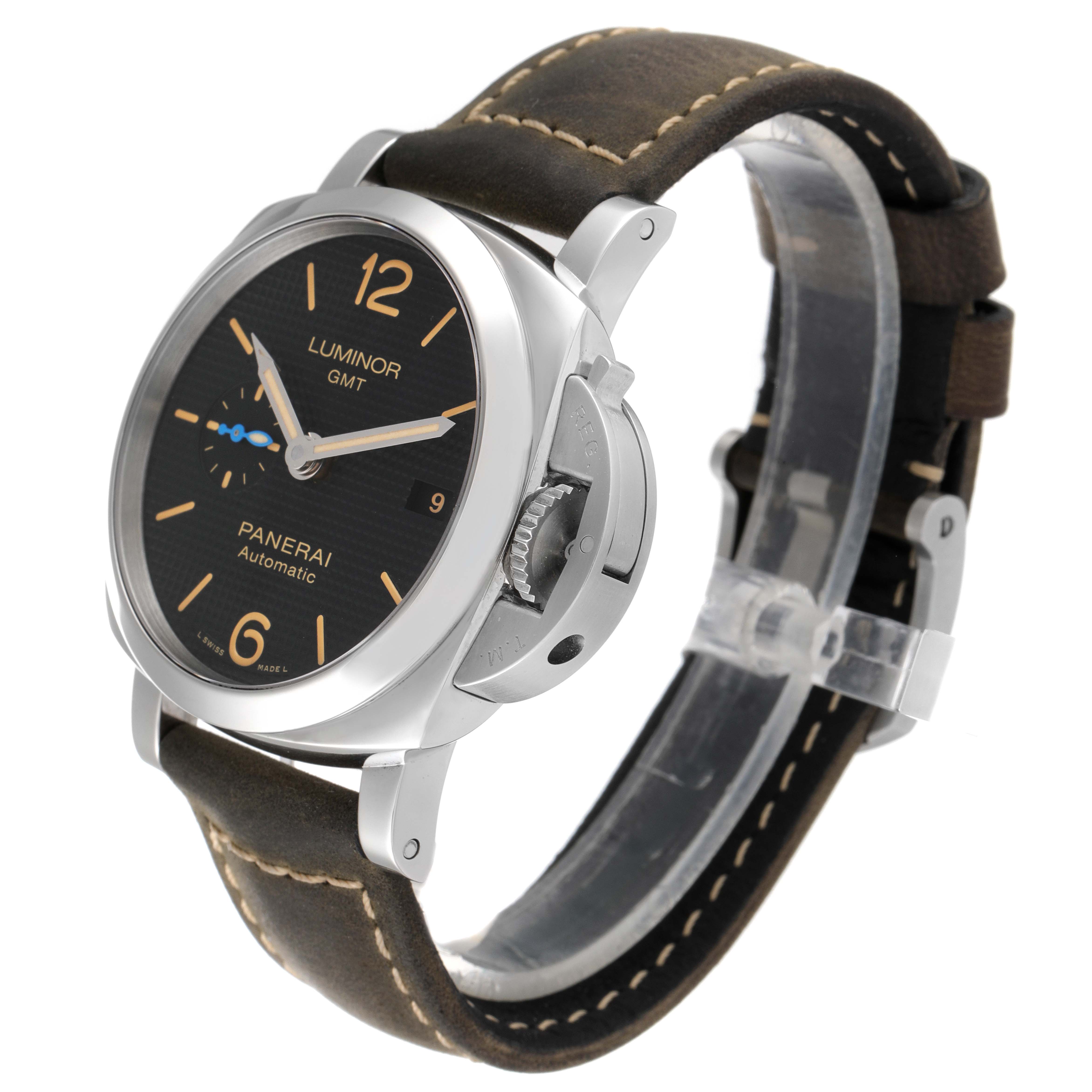 The Panerai Luminor PAM01535 Men
s Stainless Steel Black Dial PAM01535 Men
s Stainless Steel Black Dial GMT watch is shown at an angle revealing the face, crown guard, and leather strap.