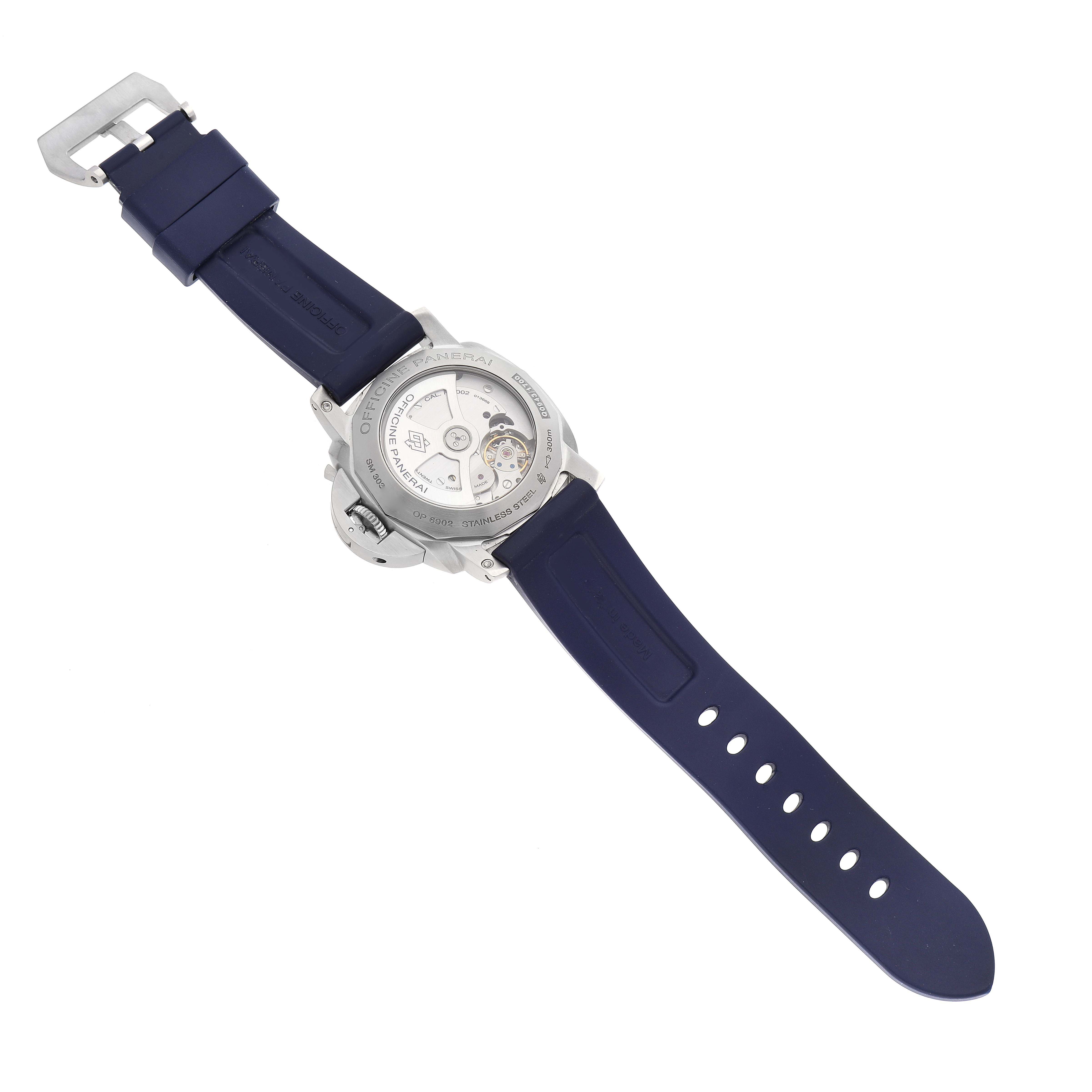 The image shows the back view of a Luminor model watch by Panerai, highlighting the open case back and rubber strap.