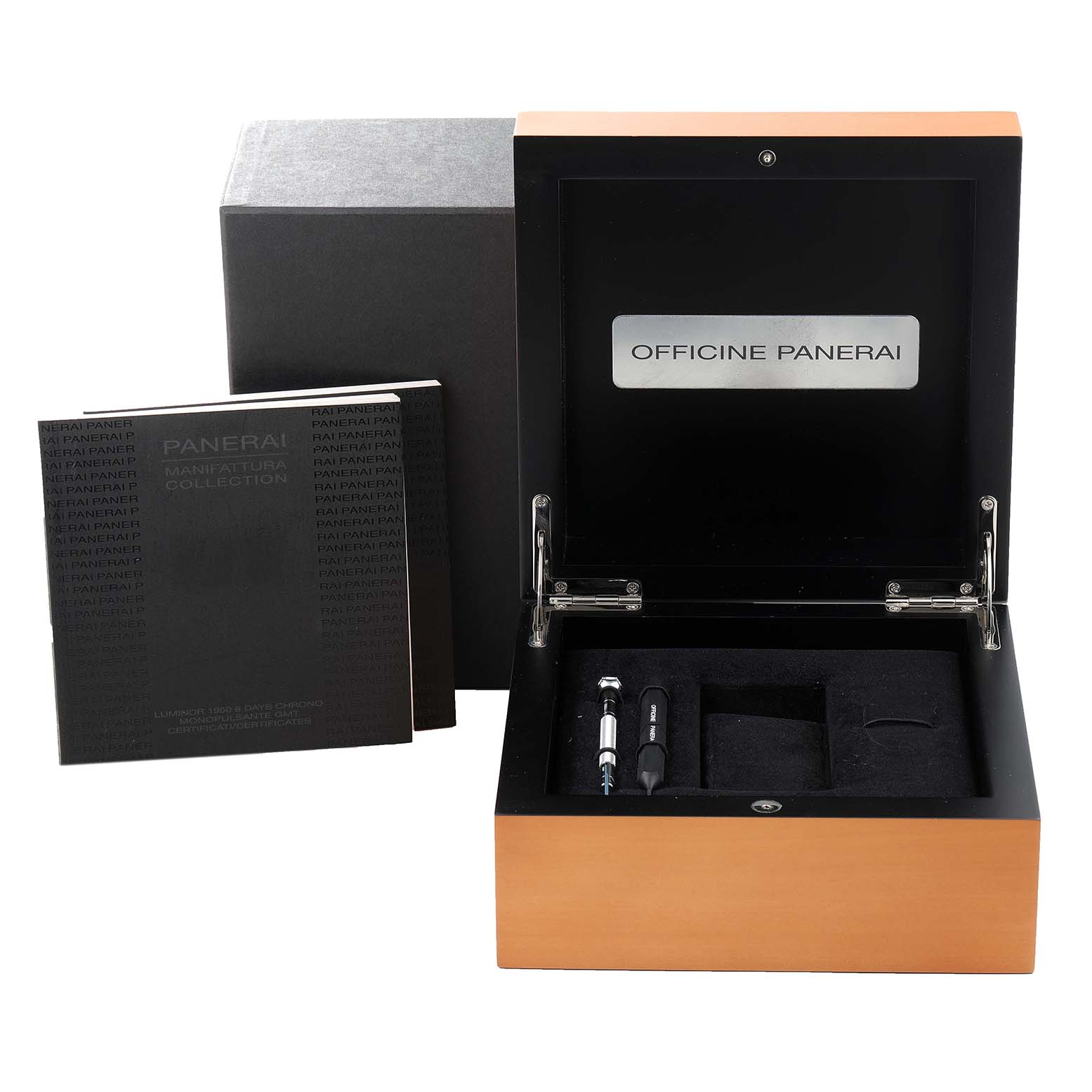 The image shows an open Panerai Luminor PAM00311 Men's Titanium Black Dial PAM00311 Men's Titanium Black Dial watch box with a booklet and tools, viewed from above.