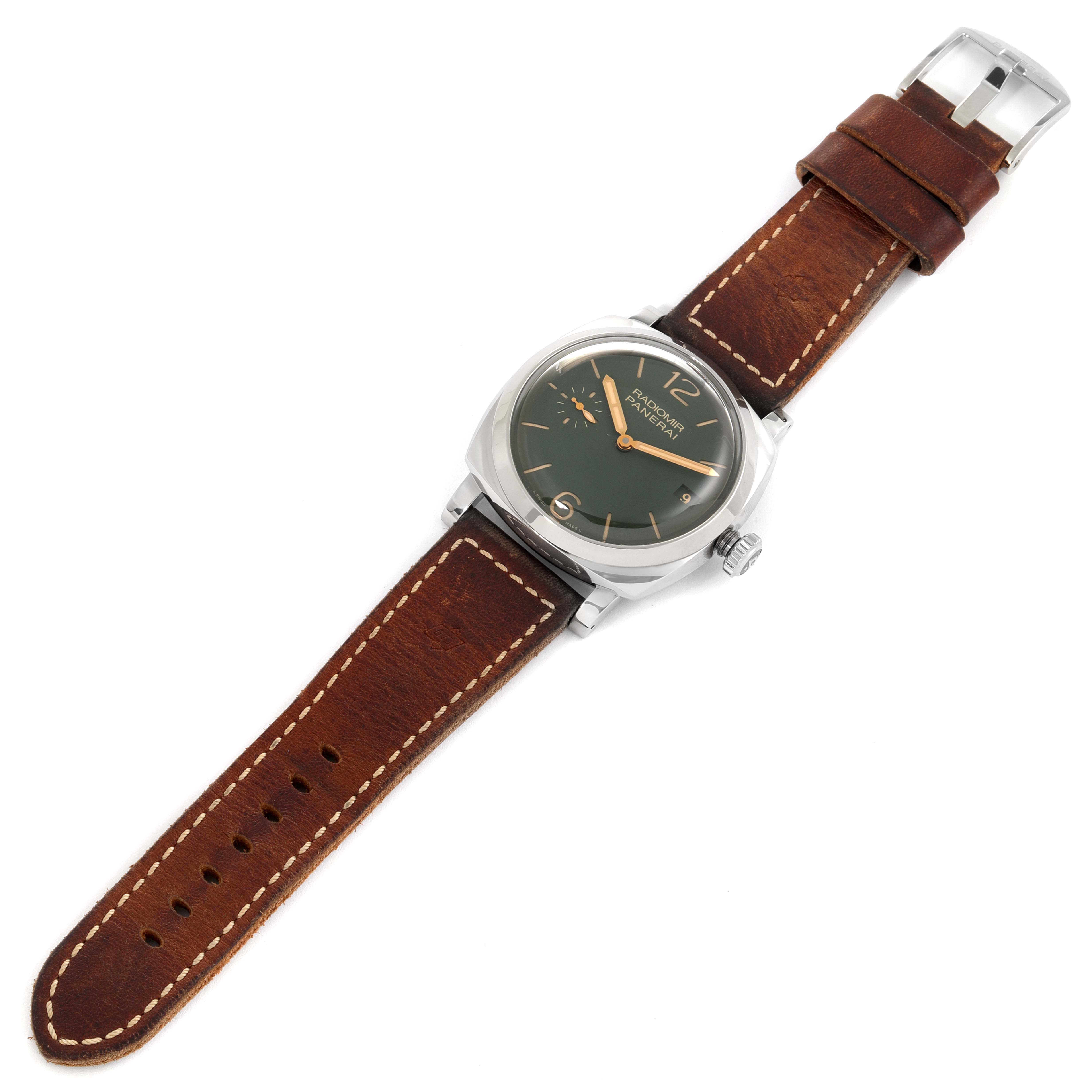 The image shows a Panerai Radiomir PAM00736 Men's Stainless Steel Green Dial PAM00736 Men's Stainless Steel Green Dial watch from an aerial view, highlighting its dial, case, crown, and leather strap.