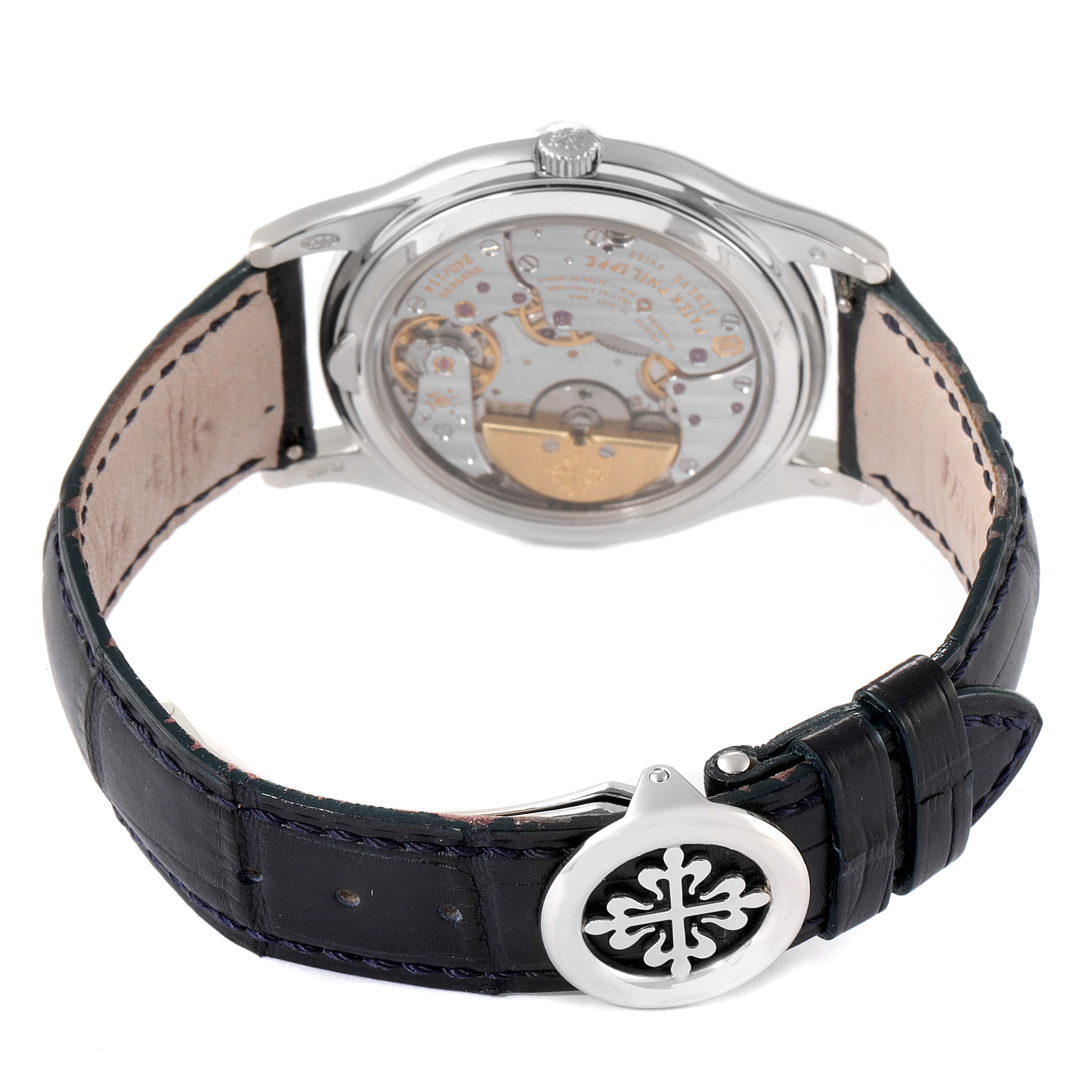 The Patek Philippe Complications 5140P-001 Men's Platinum Blue Dial 5140P-001 Men's Platinum Blue Dial watch is shown from the back, displaying its movement and leather strap with buckle.