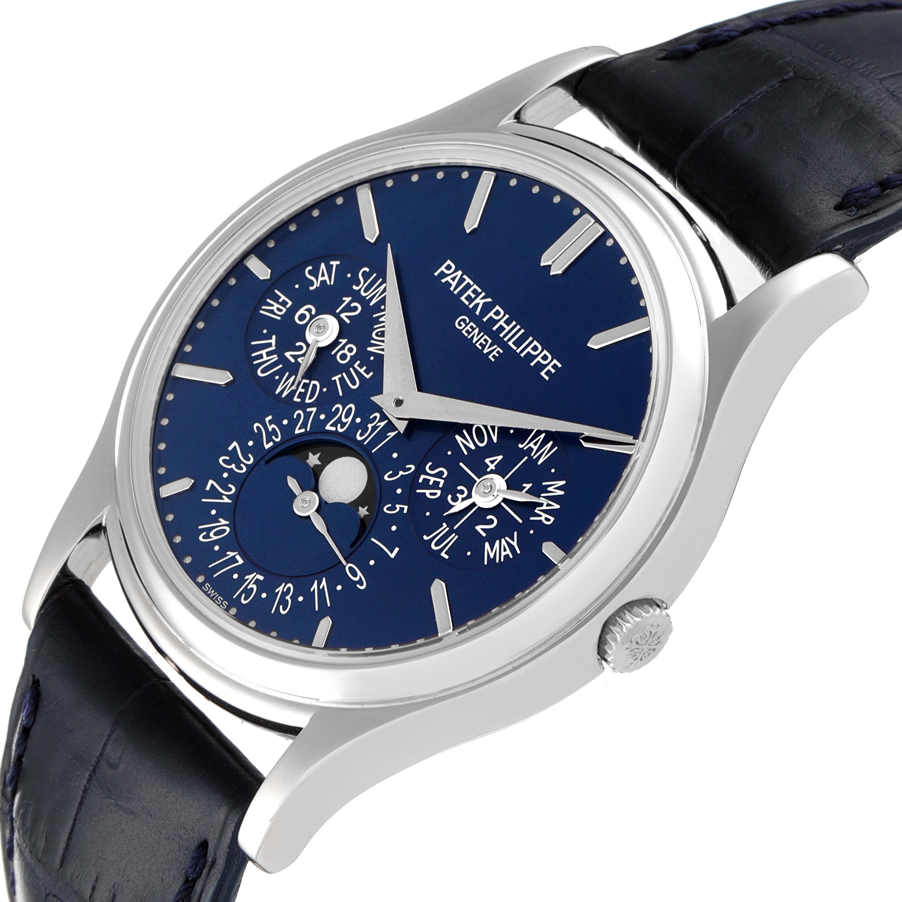 The Patek Philippe Complications 5140P-001 Men's Platinum Blue Dial 5140P-001 Men's Platinum Blue Dial watch is shown at a slight angle, displaying the face and part of the black leather strap.