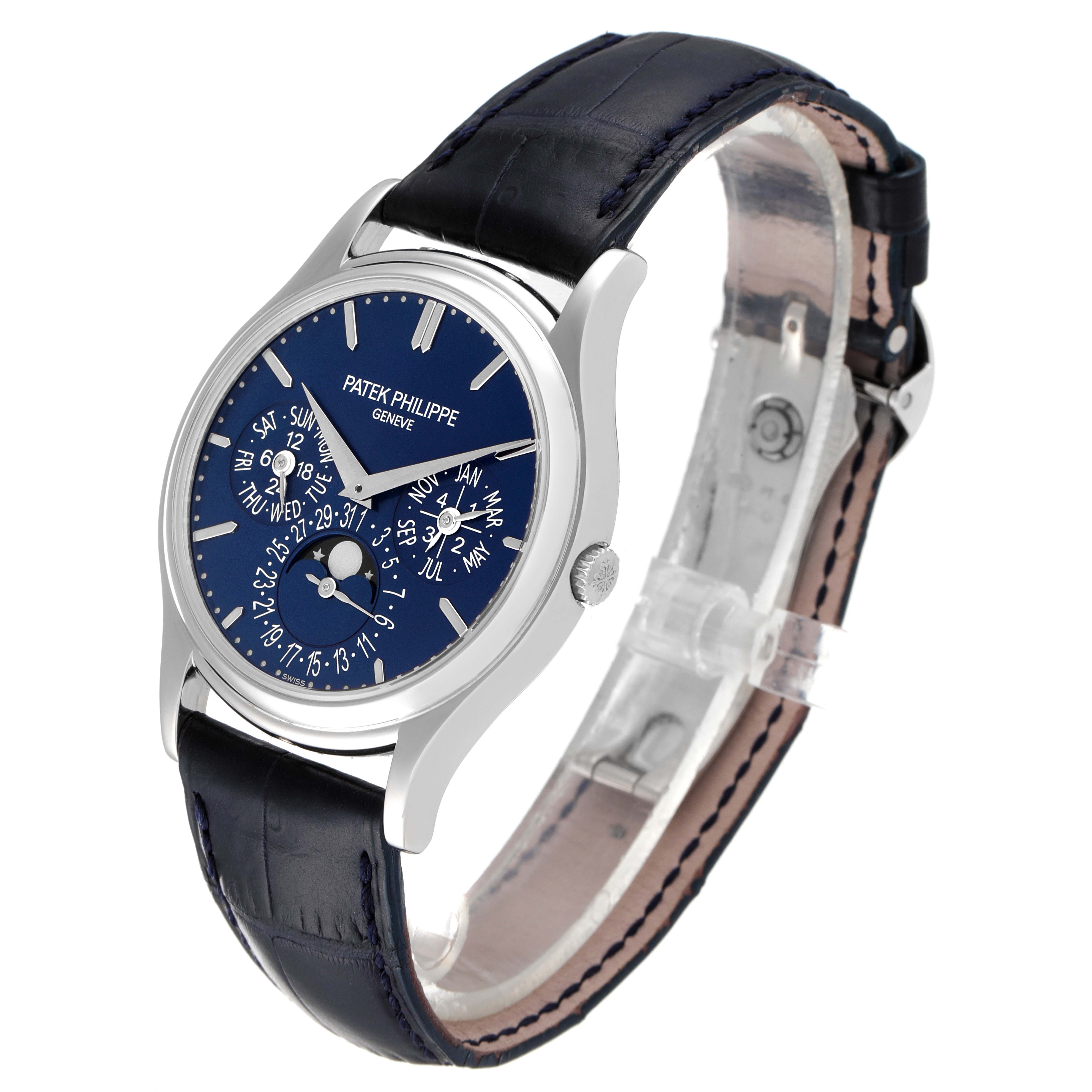 The image shows a Patek Philippe Complications 5140P-001 Men's Platinum Blue Dial 5140P-001 Men's Platinum Blue Dial model watch in a three-quarter view angle, highlighting its dial and leather strap.