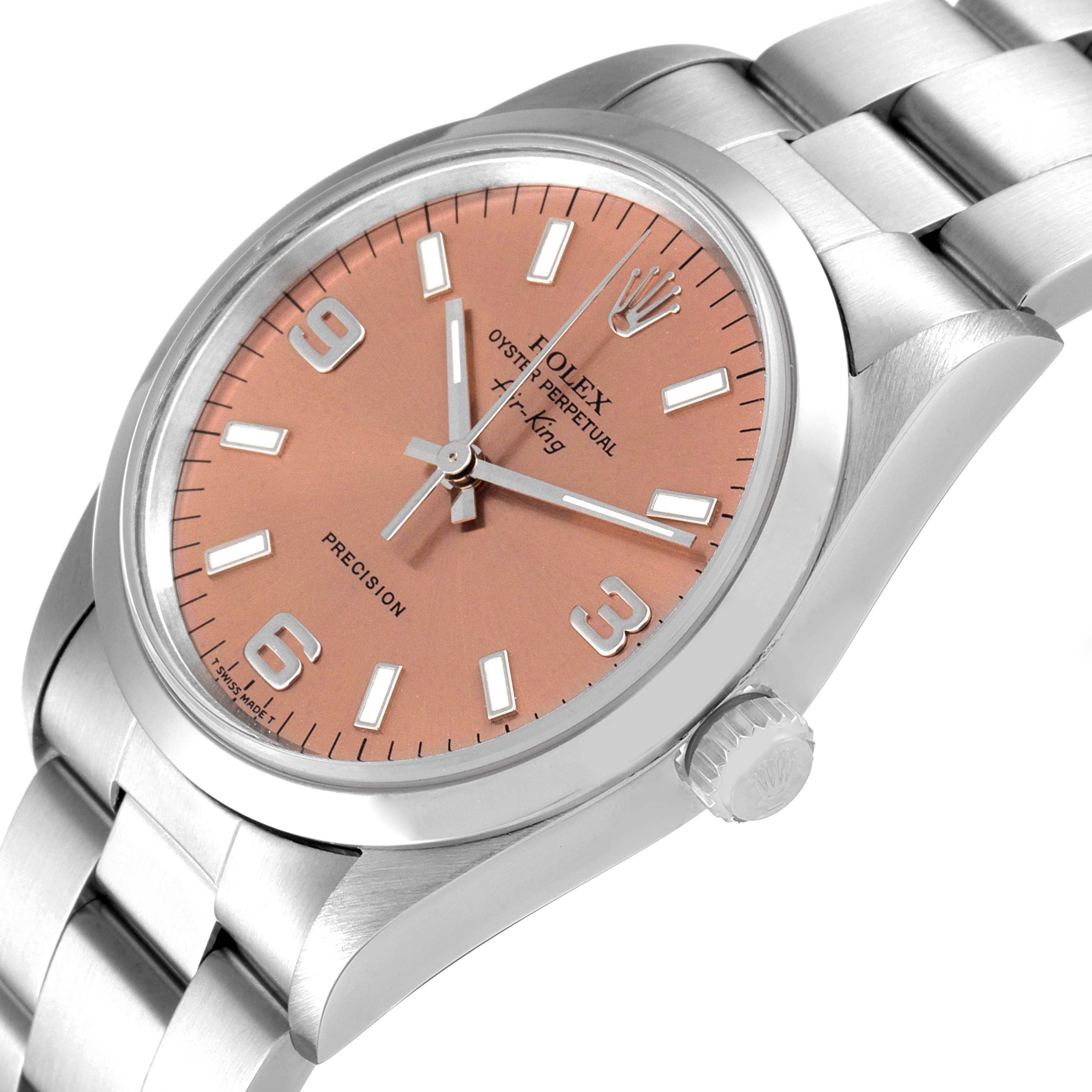 The Rolex Air-King 14000 Men's Stainless Steel Pink Dial 14000 Men's Stainless Steel Pink Dial watch is shown at an angle highlighting its face, bezel, crown, and part of its bracelet.