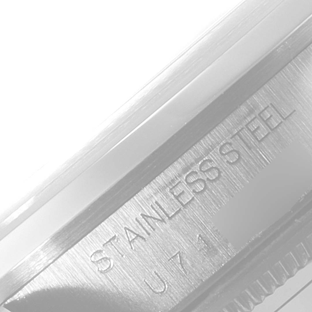 The image shows a close-up of the stainless steel detailing on the casing of a Rolex Air-King 14000 Men's Stainless Steel Pink Dial 14000 Men's Stainless Steel Pink Dial watch.