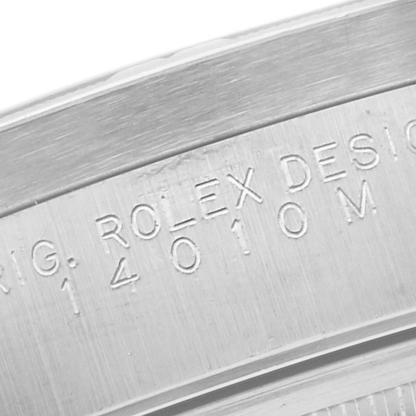 This close-up image shows the engraved details on the case back edge of a Rolex Air-King 14010M Men's Stainless Steel White Dial 14010M Men's Stainless Steel White Dial watch.