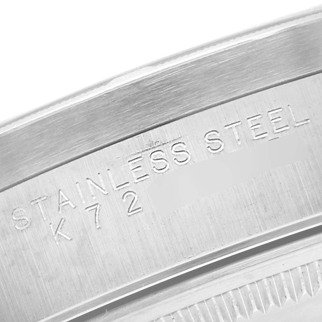 This is a close-up shot of the stainless steel case back of a Rolex Air-King 14010M Men's Stainless Steel White Dial 14010M Men's Stainless Steel White Dial watch, showing engraved text.