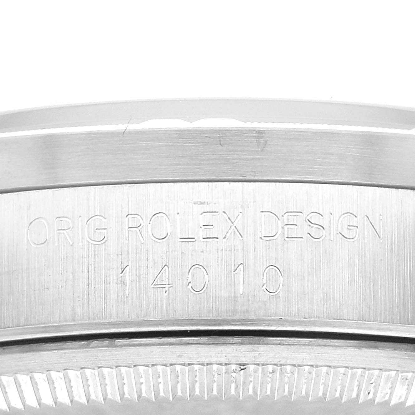 This close-up image shows the side engraving on the bezel of a Rolex Air-King 14010 Men's Stainless Steel Blue Dial 14010 Men's Stainless Steel Blue Dial watch, displaying the model number "14010" and "Orig Rolex Design".